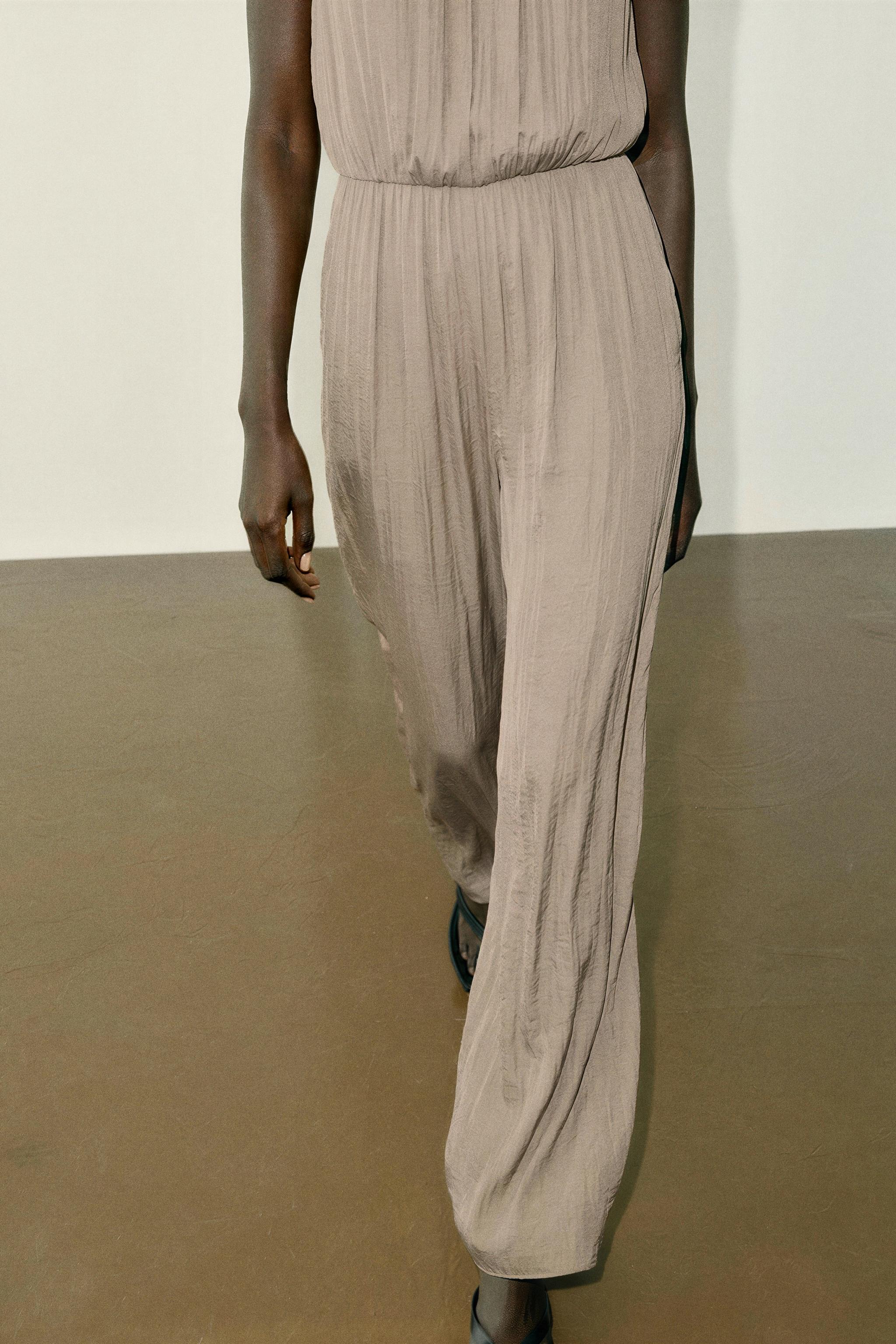 SATIN JUMPSUIT WITH SHOULDER FROG FASTENING