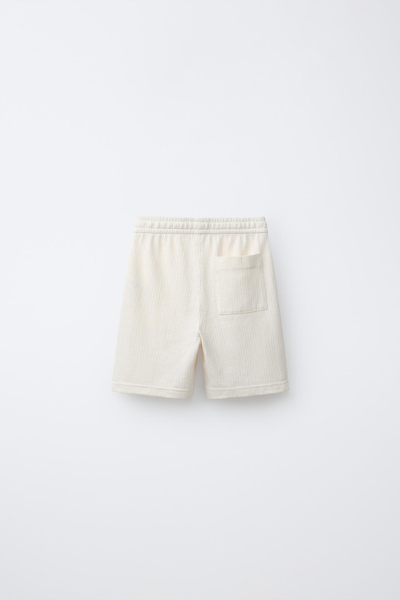 TEXTURED RUSTIC SHORTS — Ecru