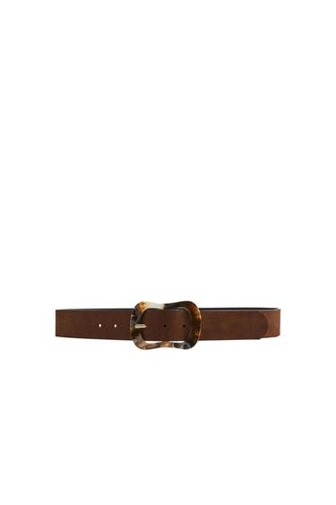 Front view of a brown belt with a decorative oval buckle.