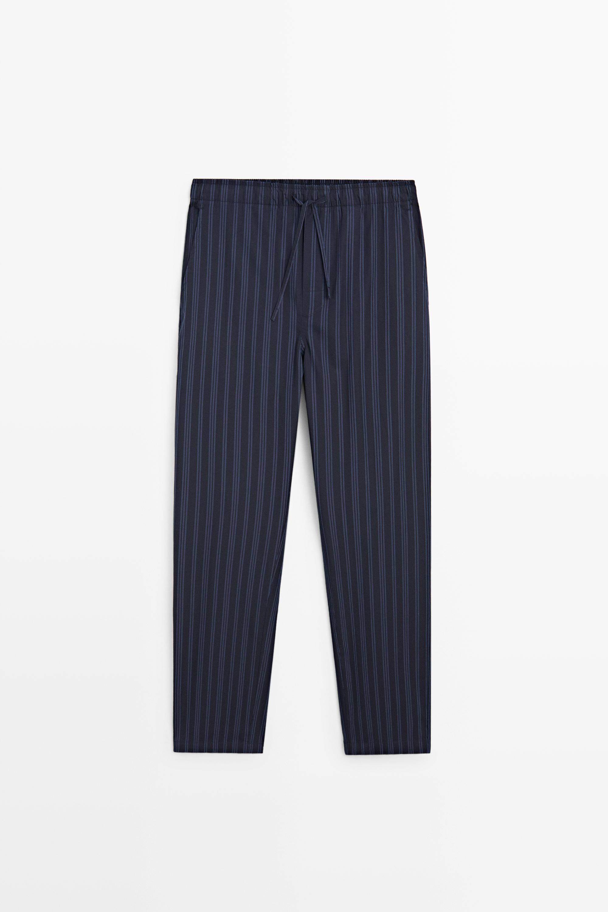 Short sleeve pyjama top and striped trousers