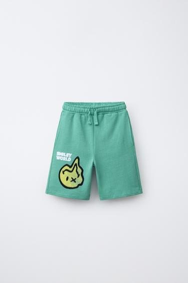 KRATKE HLAČE S POTISKOM SMILEYWORLD ® - Zelena od Zare