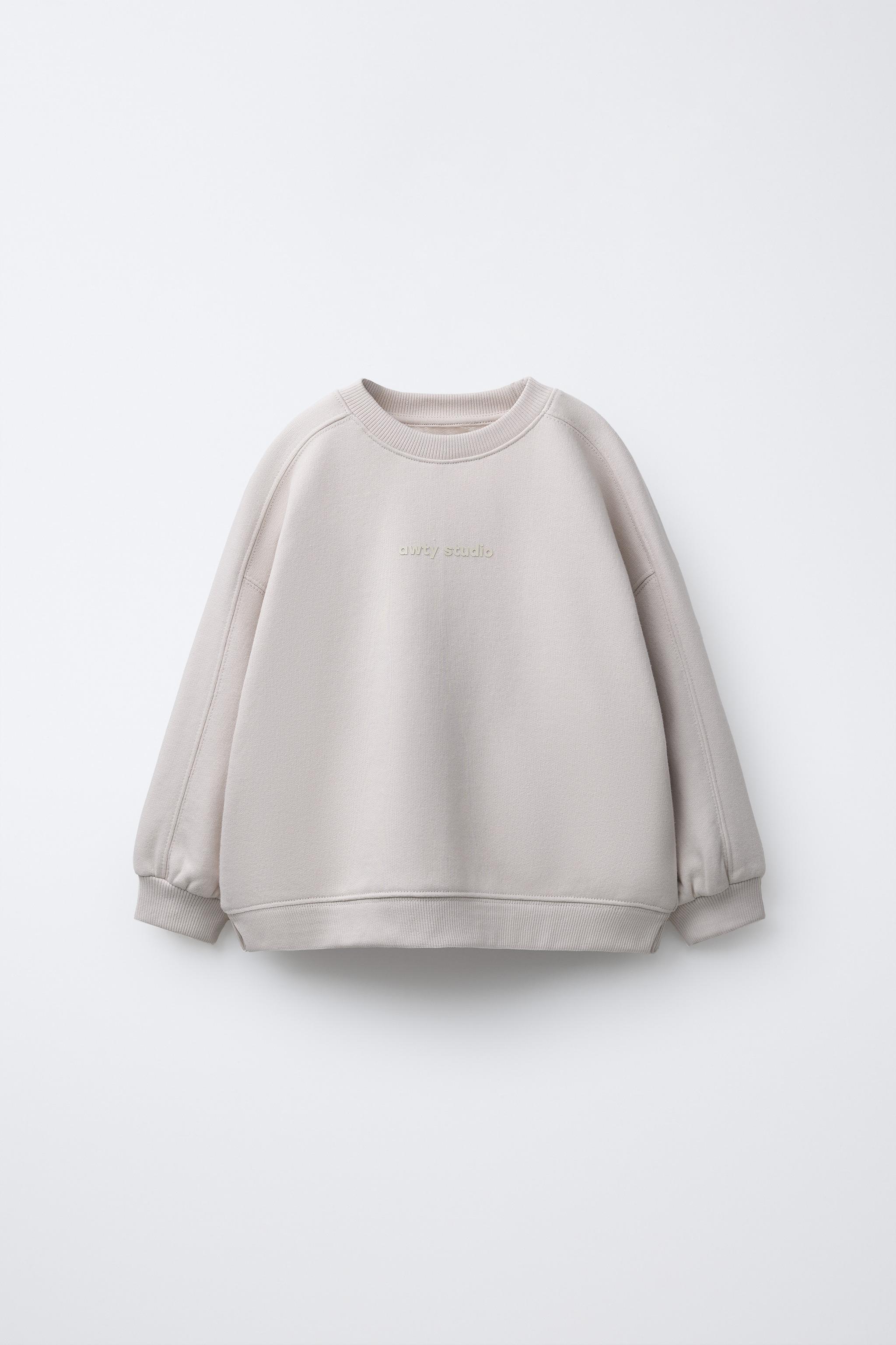 SWEAT AVEC INSCRIPTION EN RELIEF
