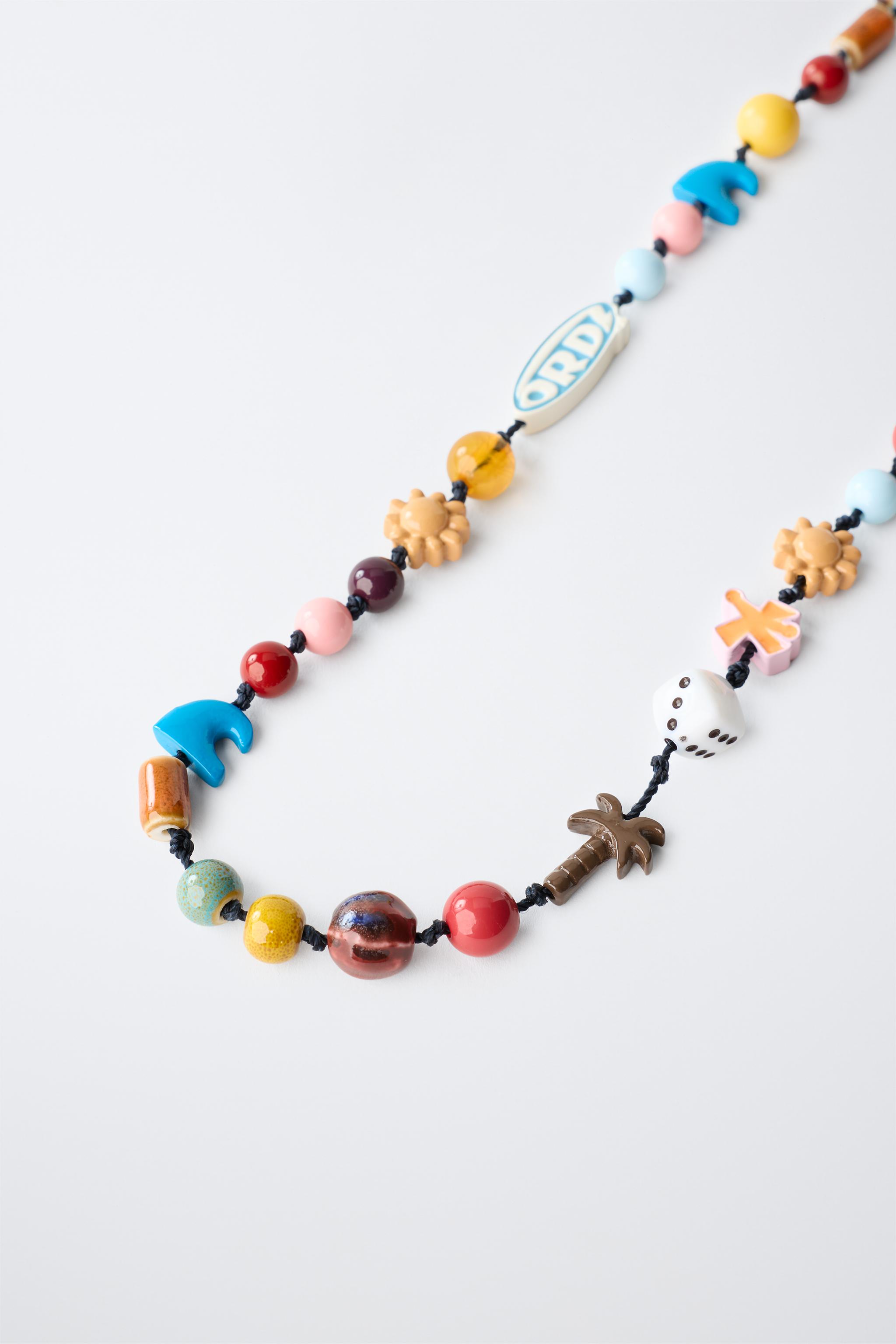 BEADED CORD NECKLACE WITH LOGO