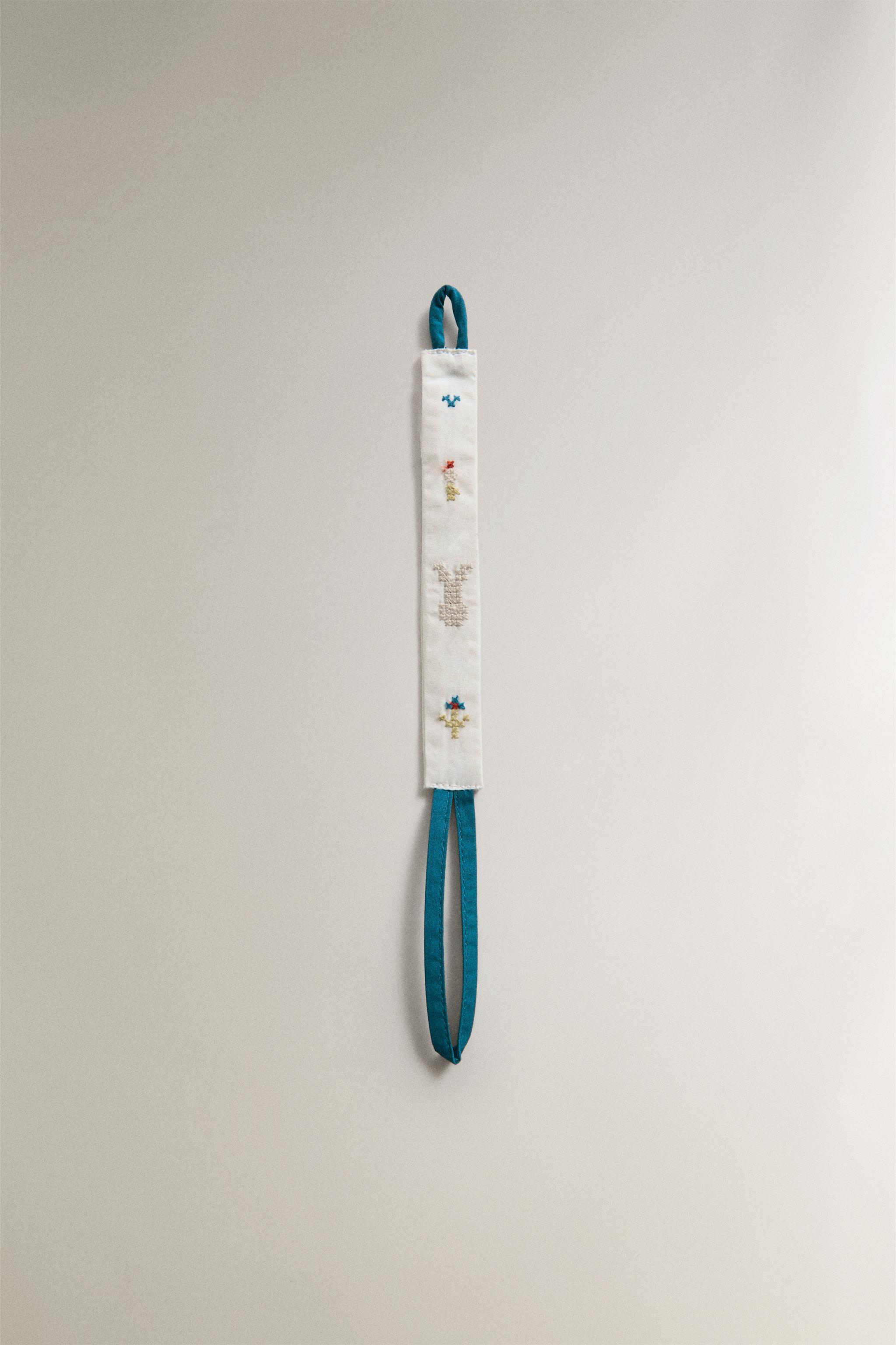 ATTACHE-SUCETTE LAPINS