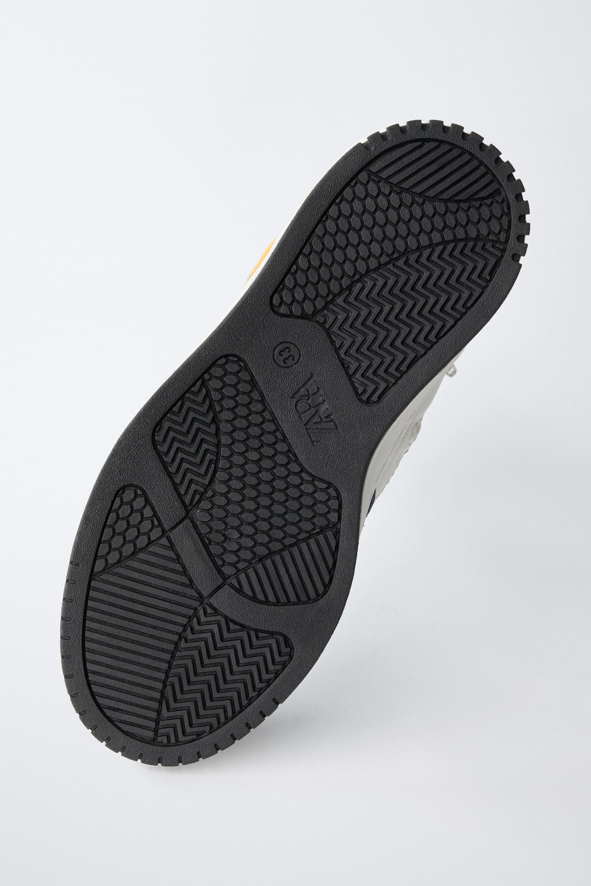 HIGH TOP SNEAKERS WITH PIECES