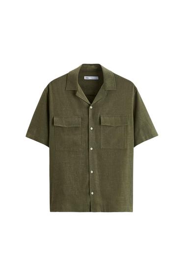 Front view of a short-sleeved olive green shirt with front pockets and button fastening.