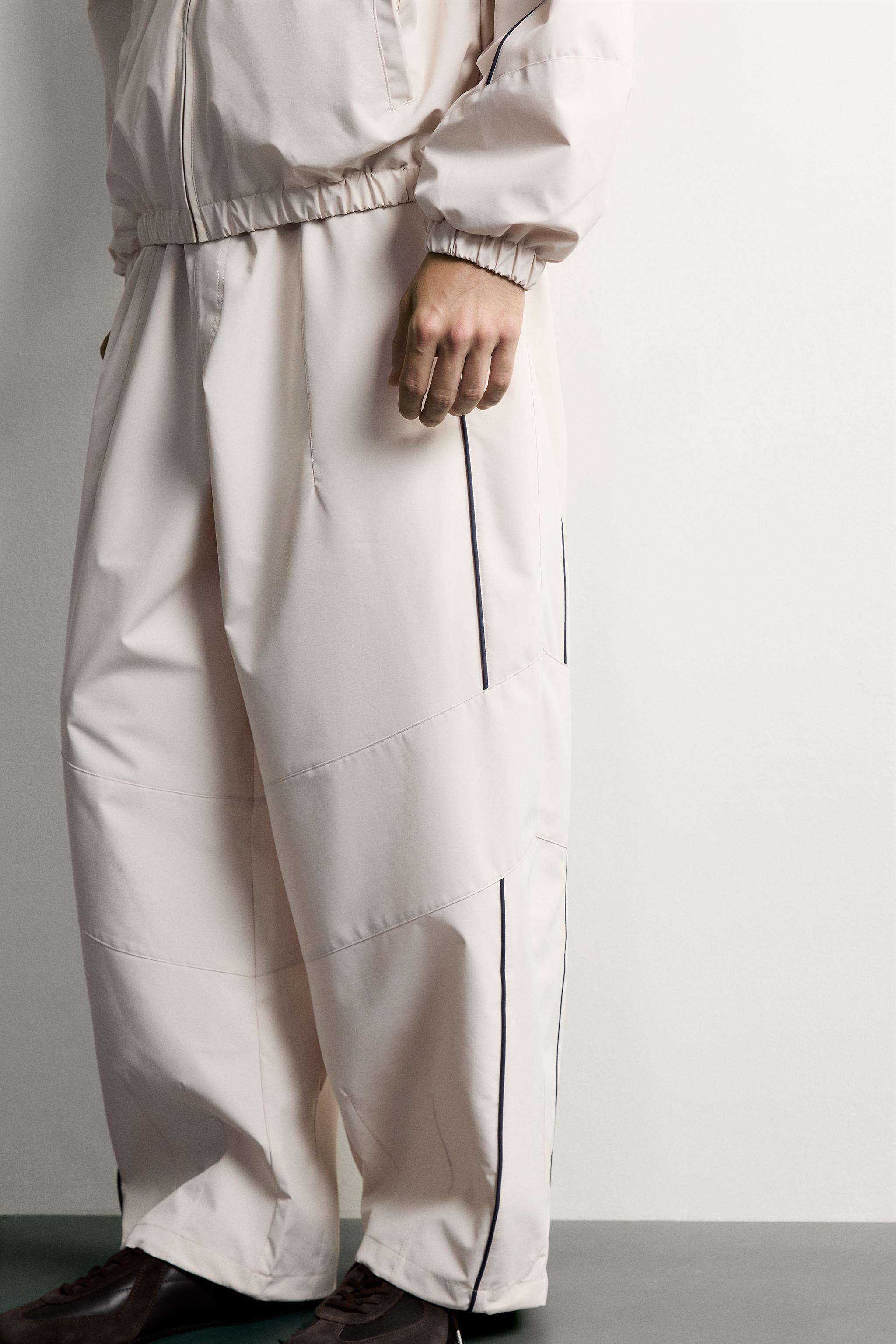 PANTALON TECHNIQUE À CONTRASTES DÉPERLANT