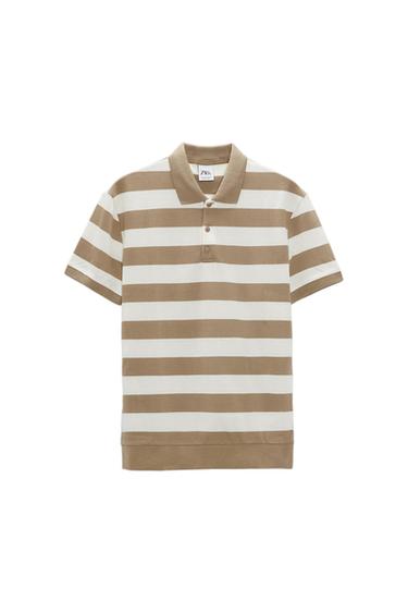 Beige and white horizontal striped polo shirt with a classic collar and three buttons. Visible label on the inside of the collar.