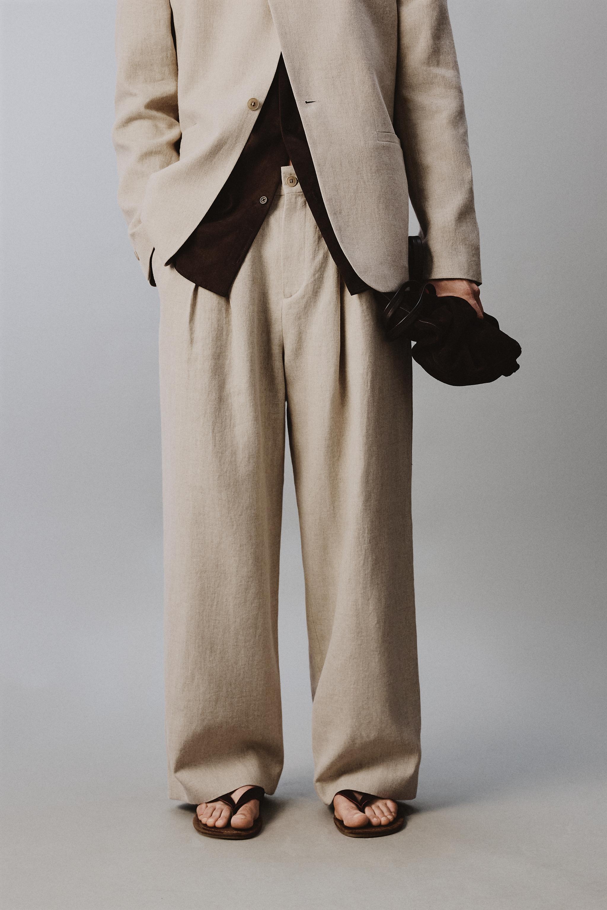 RELAXED FIT PLEATED SUIT PANTS