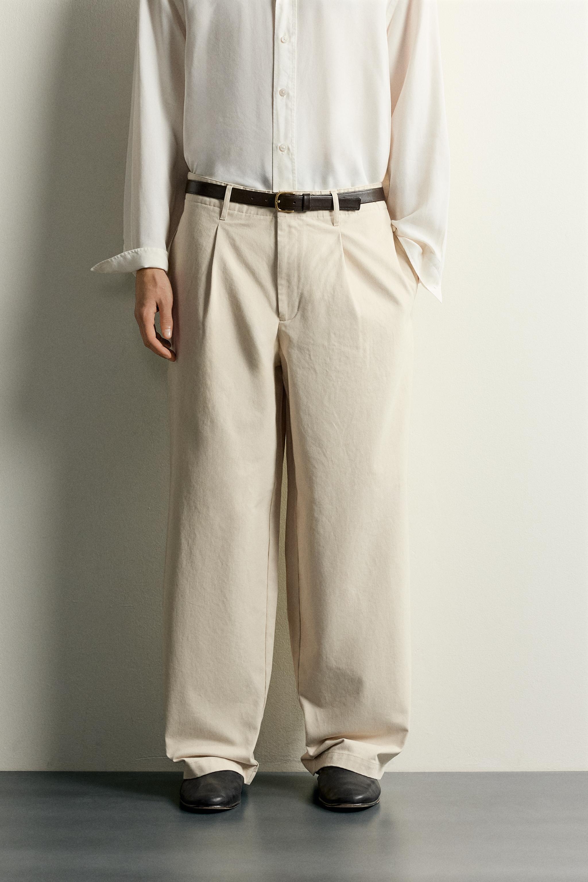 RELAXED FIT PLEATED PANTS