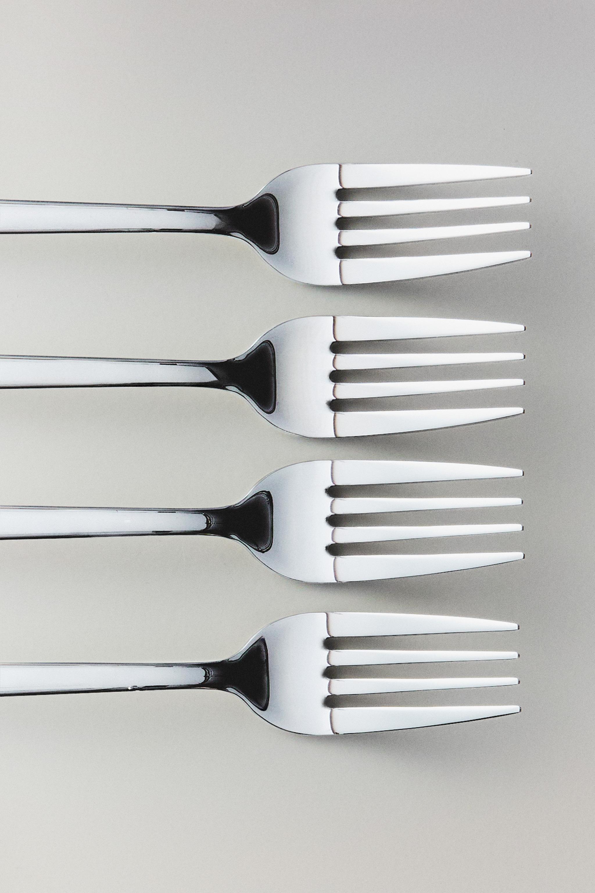 LOT DE 4 FOURCHETTES EN ACIER BRILLANT