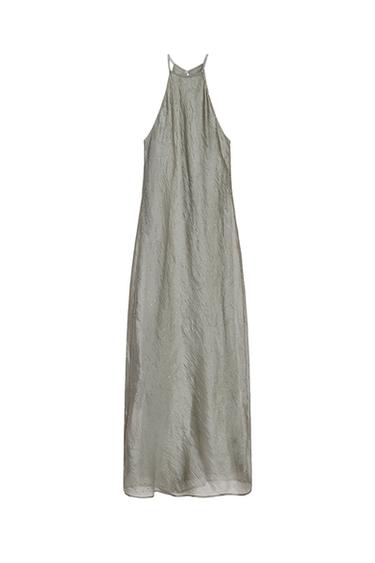 Front view of a long grey dress with a halter neck and sparkly embellishments