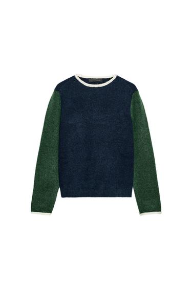 Front view of color block sweater with round neck. Dark blue body, green sleeves and white trim.