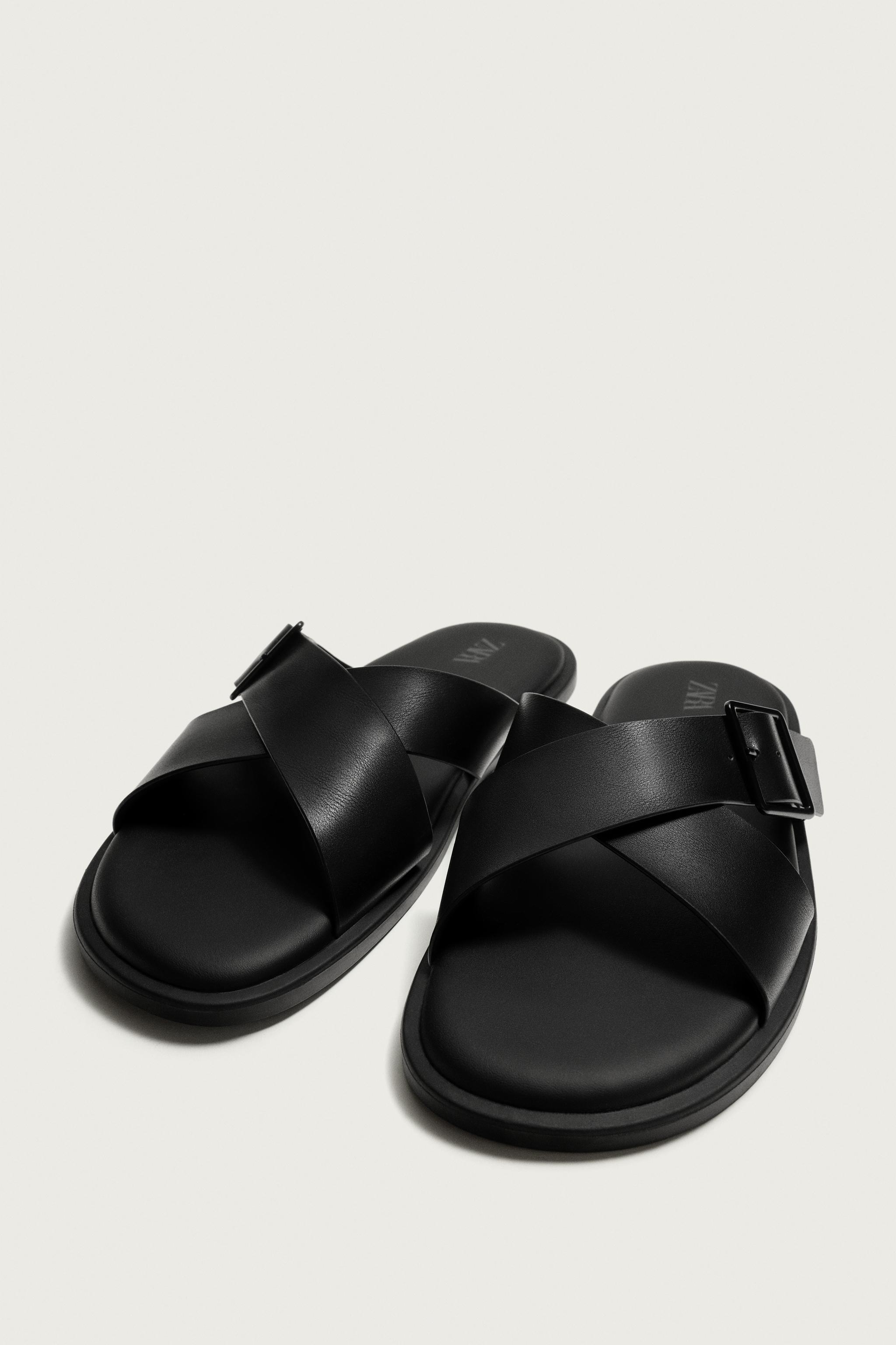 BUCKLED CRISSCROSS SANDALS