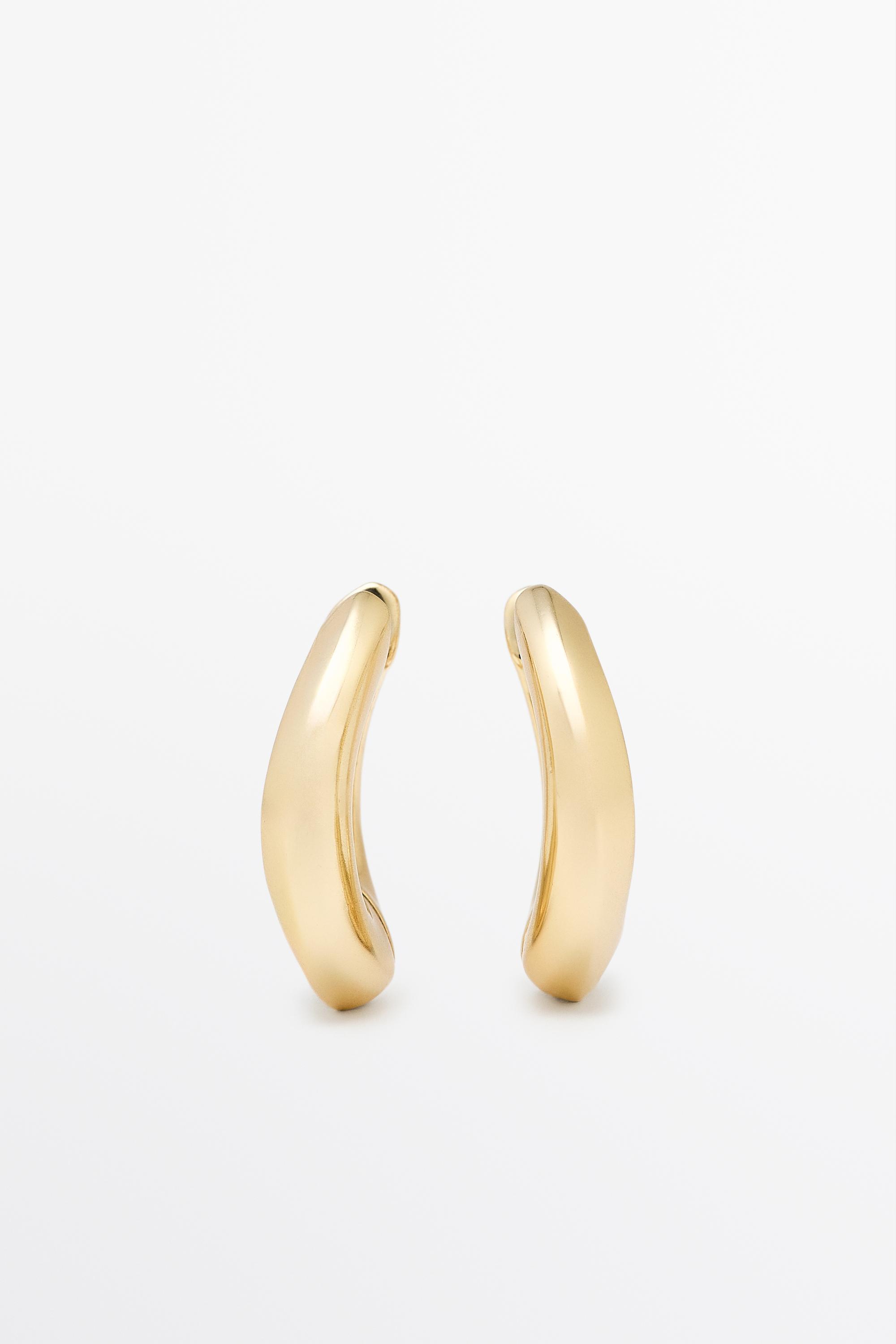 Voluminous hoop earrings — Golden