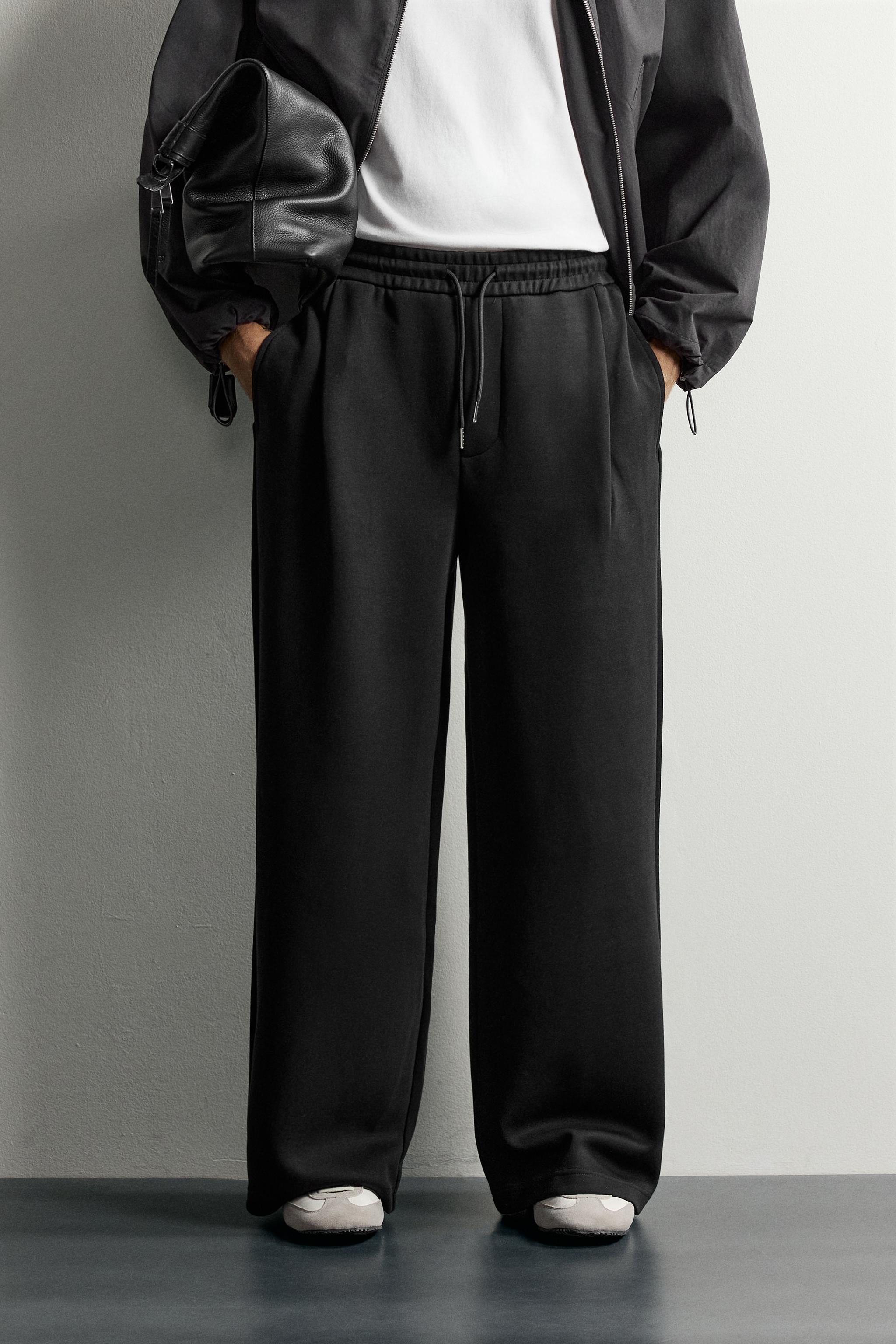 PLEATED BALLOON-FIT PANTS