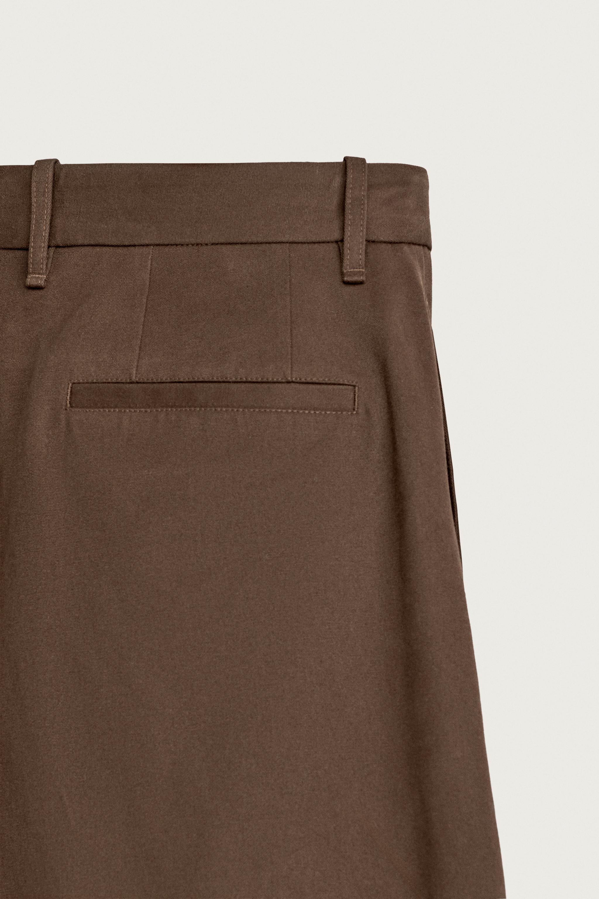 RELAXED FIT PLEATED PANTS