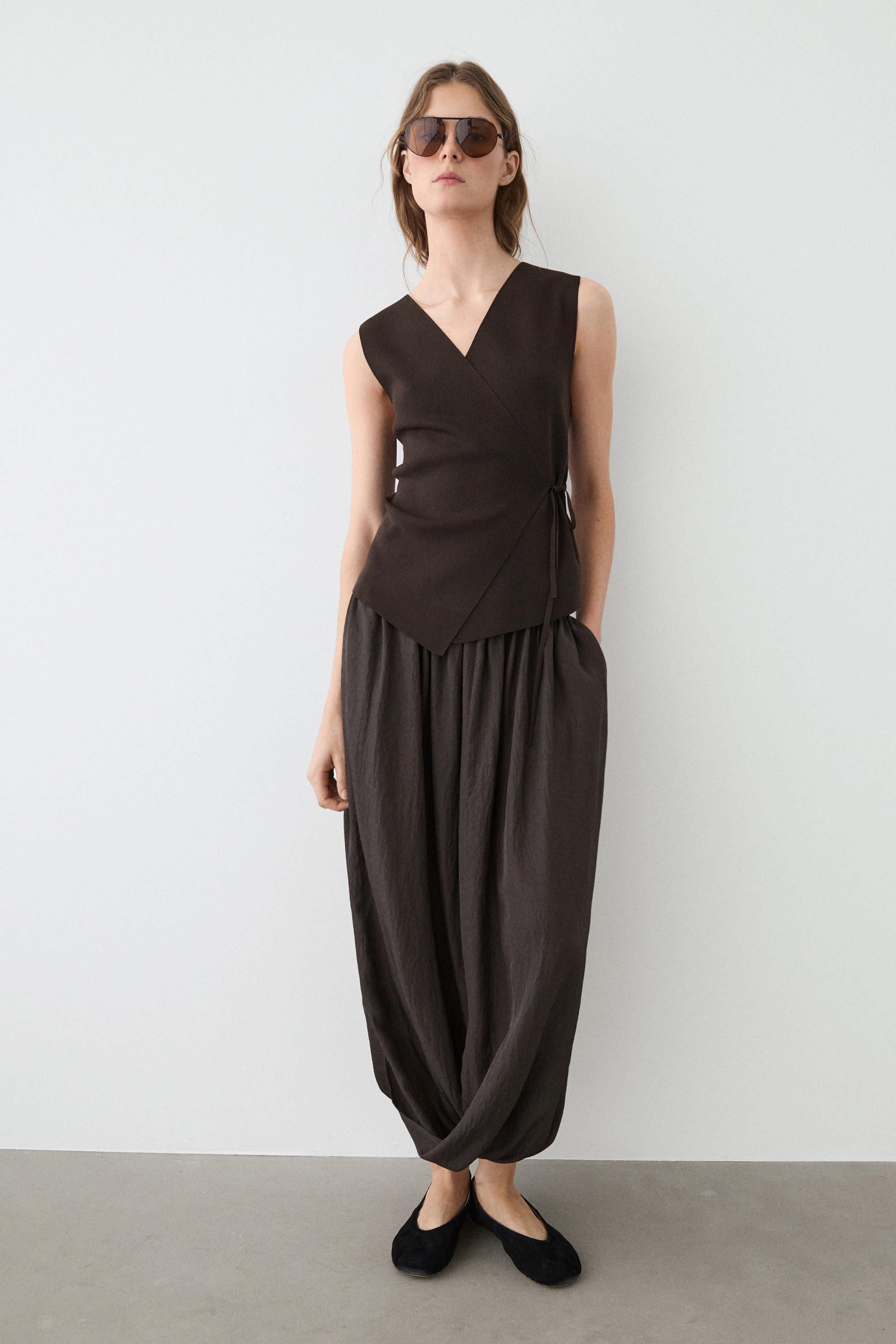 Crossover knit vest with tie detail