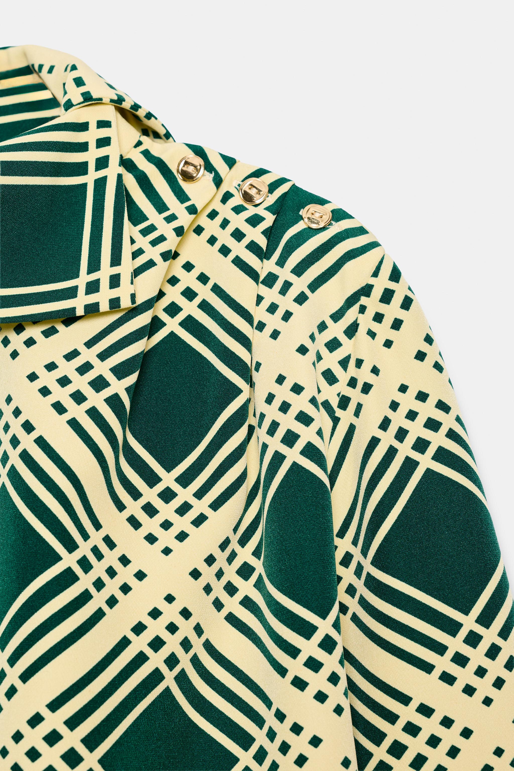BLOUSE À CARREAUX AVEC BOUTONS SUR L'ÉPAULE