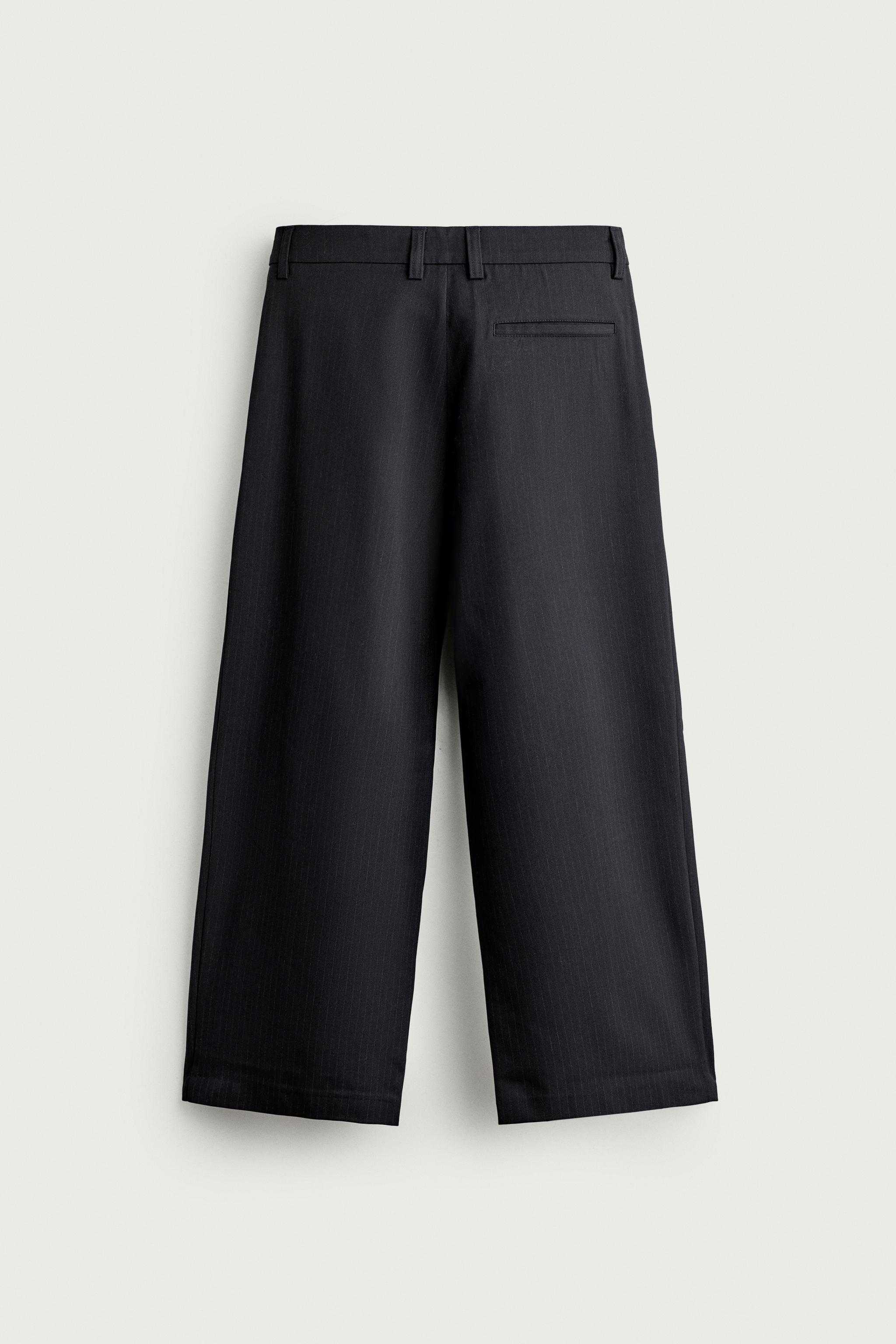 PANTALON COUPE LARGE À PLIS INVERSÉS