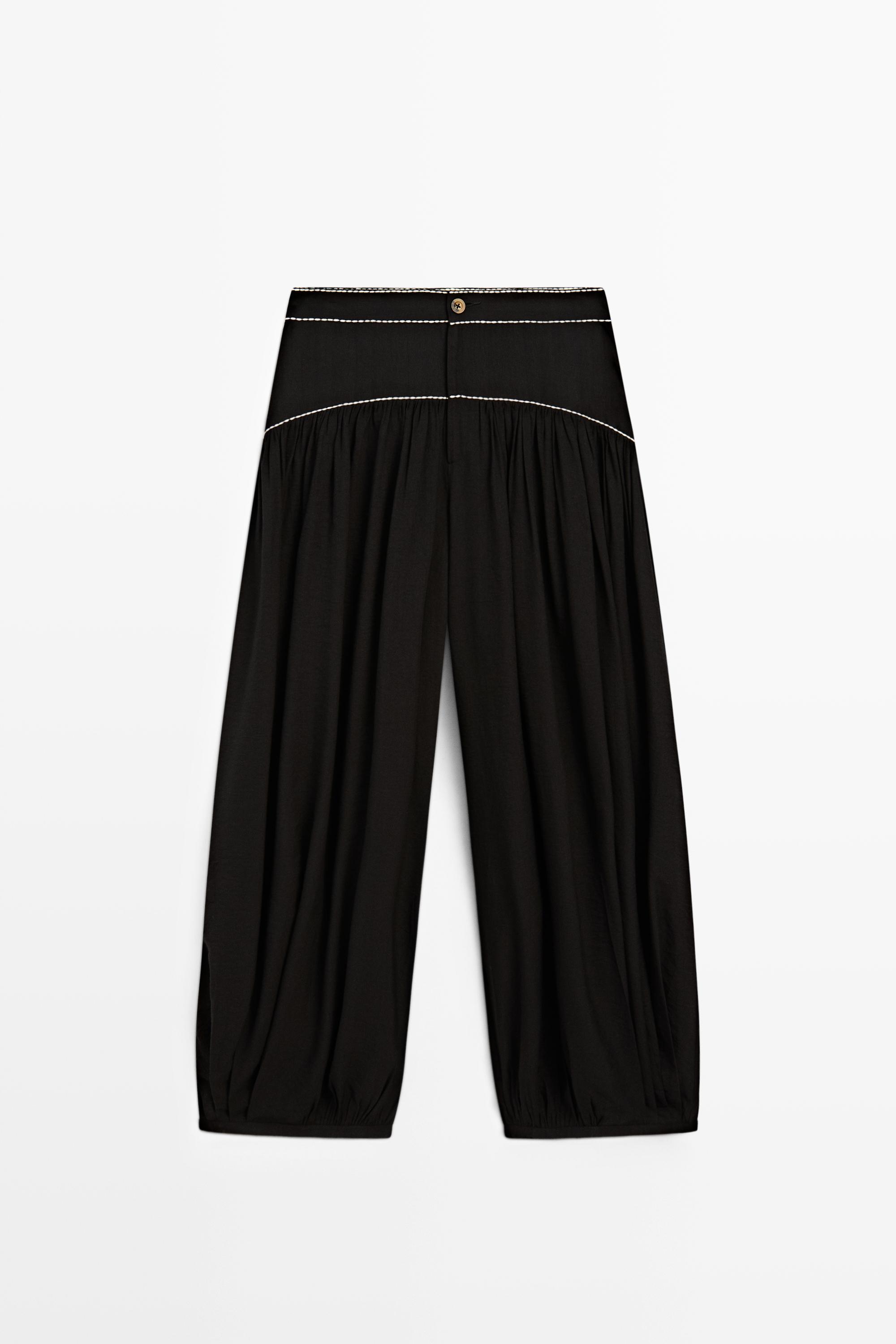 Flowing trousers with contrast detail
