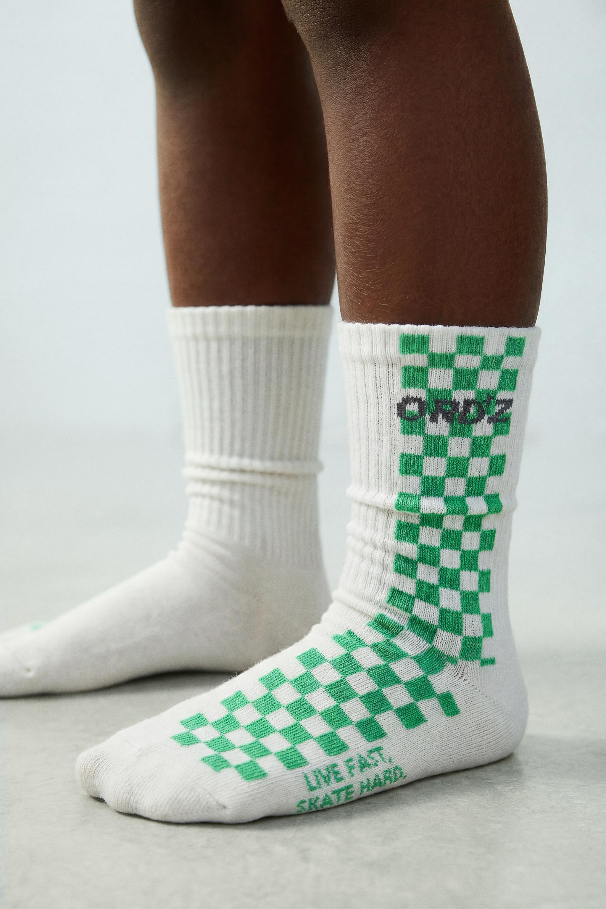 LOT DE DEUX CHAUSSETTES MONTANTES À DAMIER ET LOGO