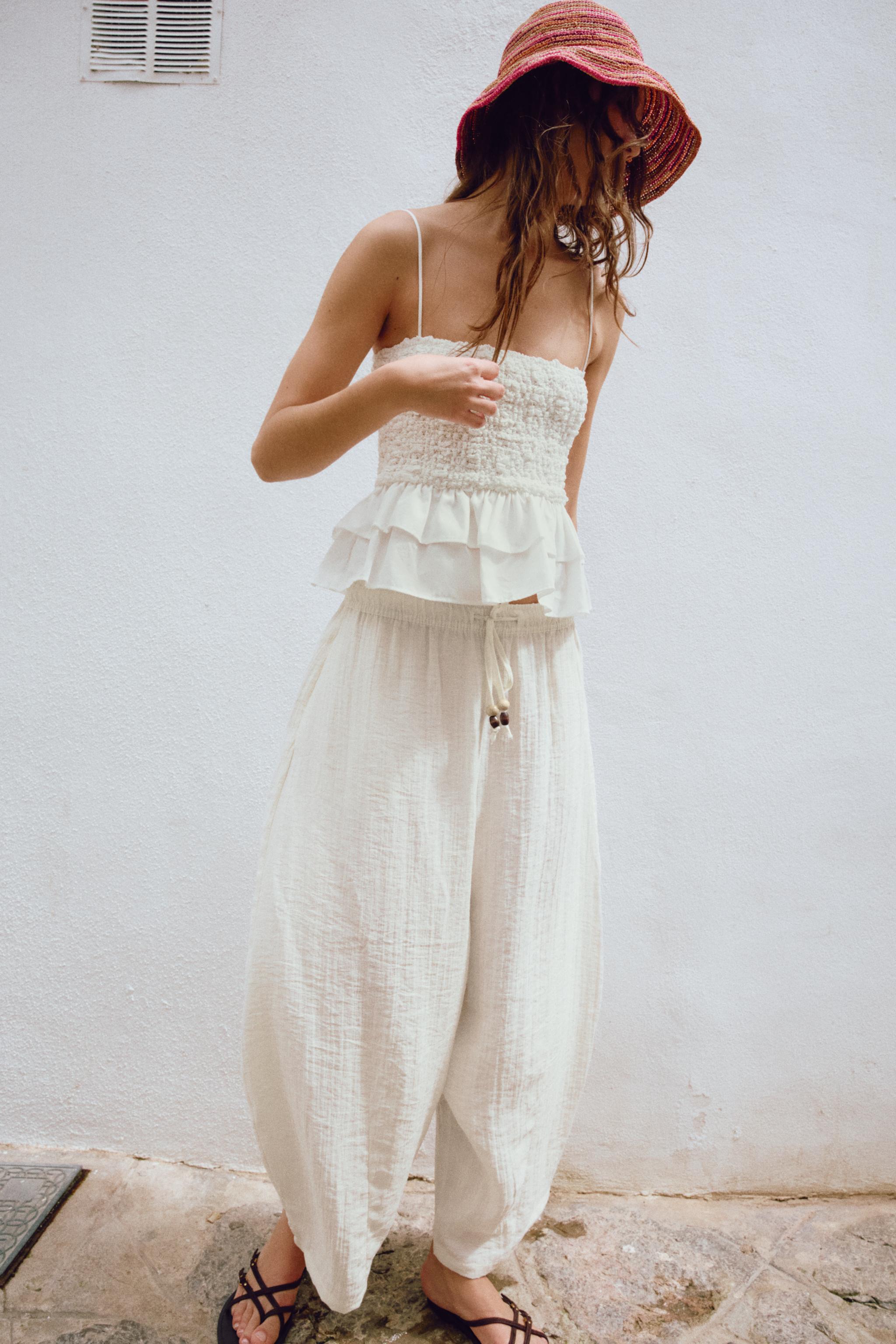 SMOCKED PEPLUM TOP — White