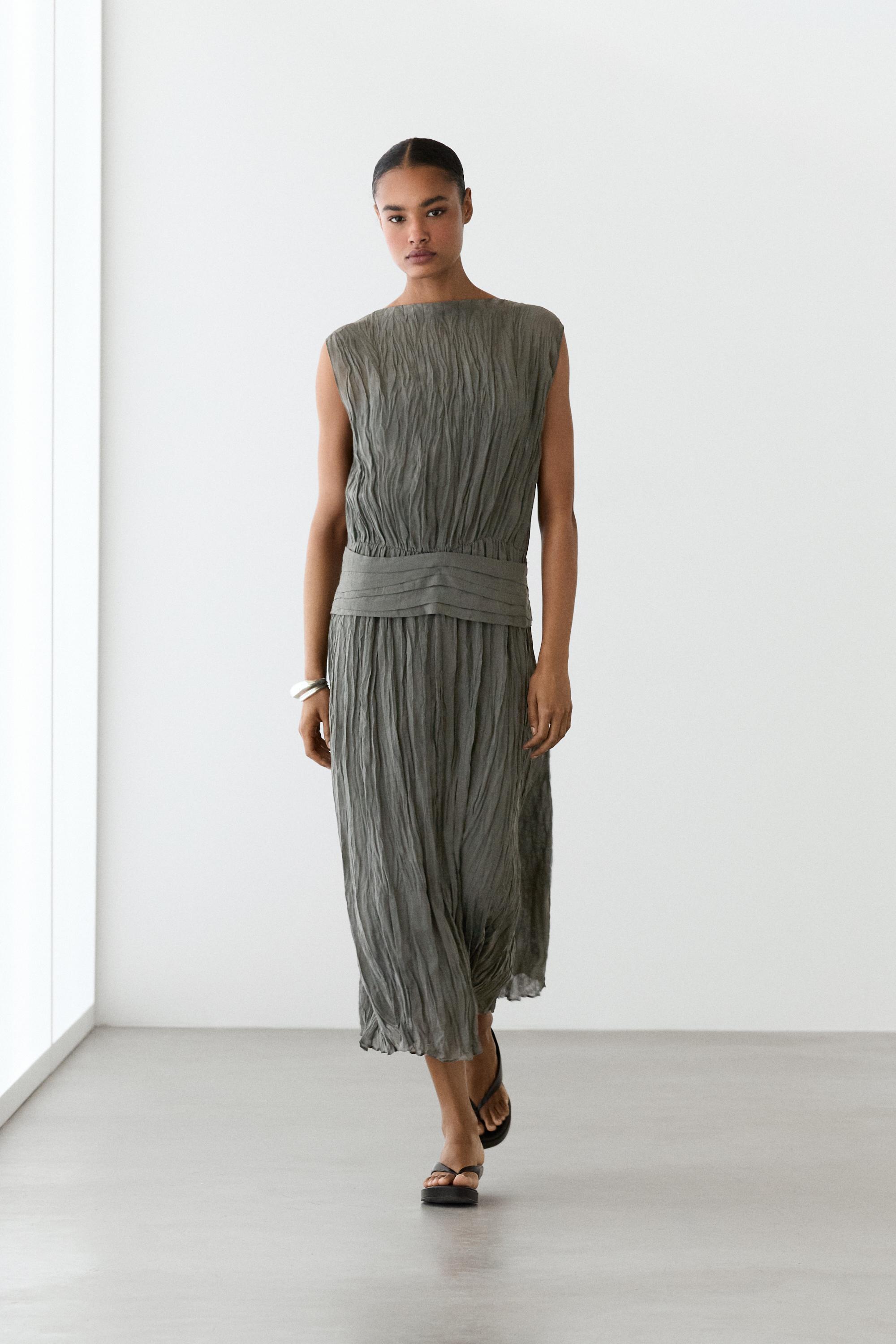 Textured flowing fabric dress with sash belt