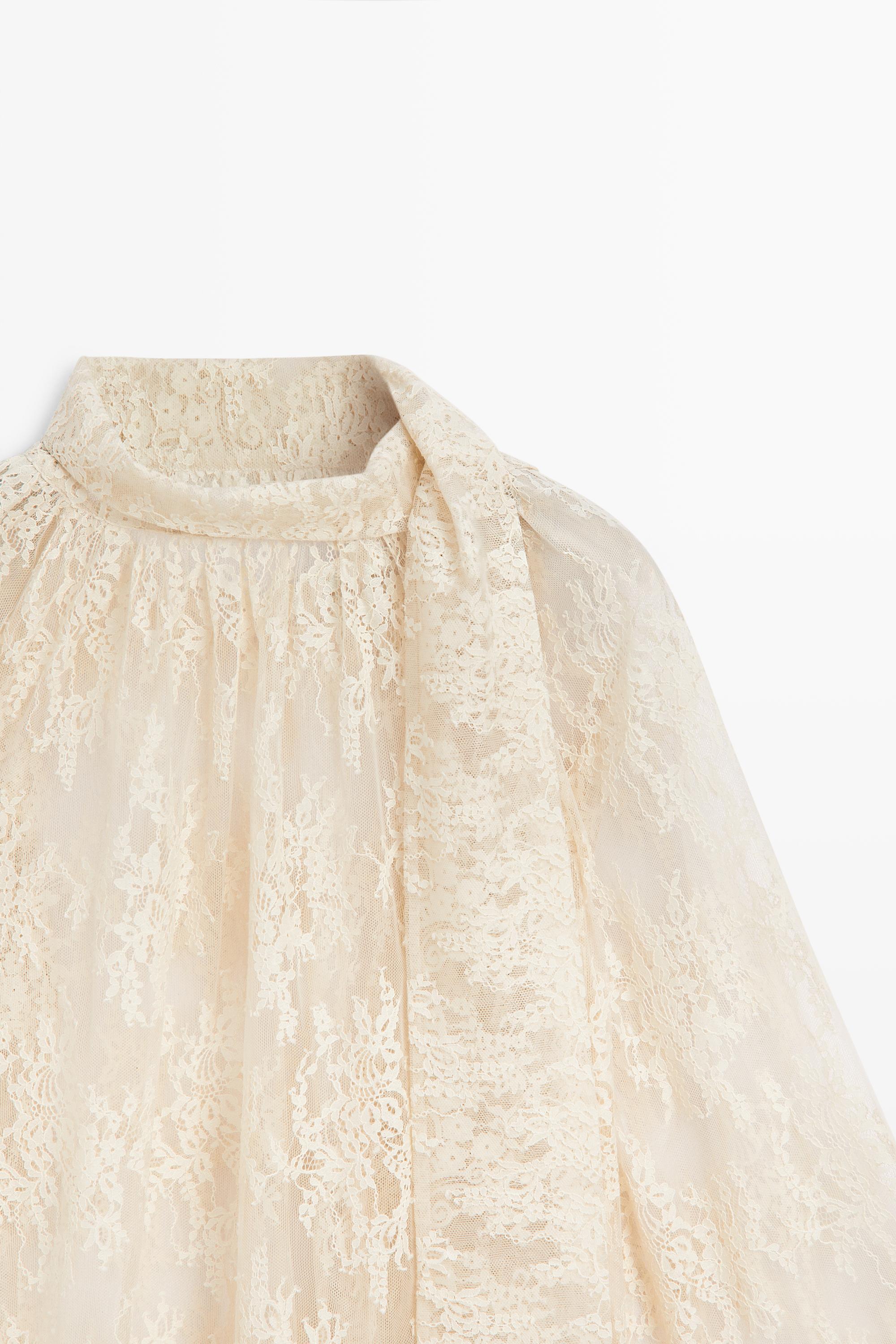 Flowing lace blouse with tie