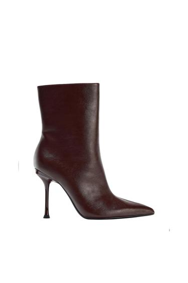 Dark brown high-heeled boot with a pointed toe, on a white background.