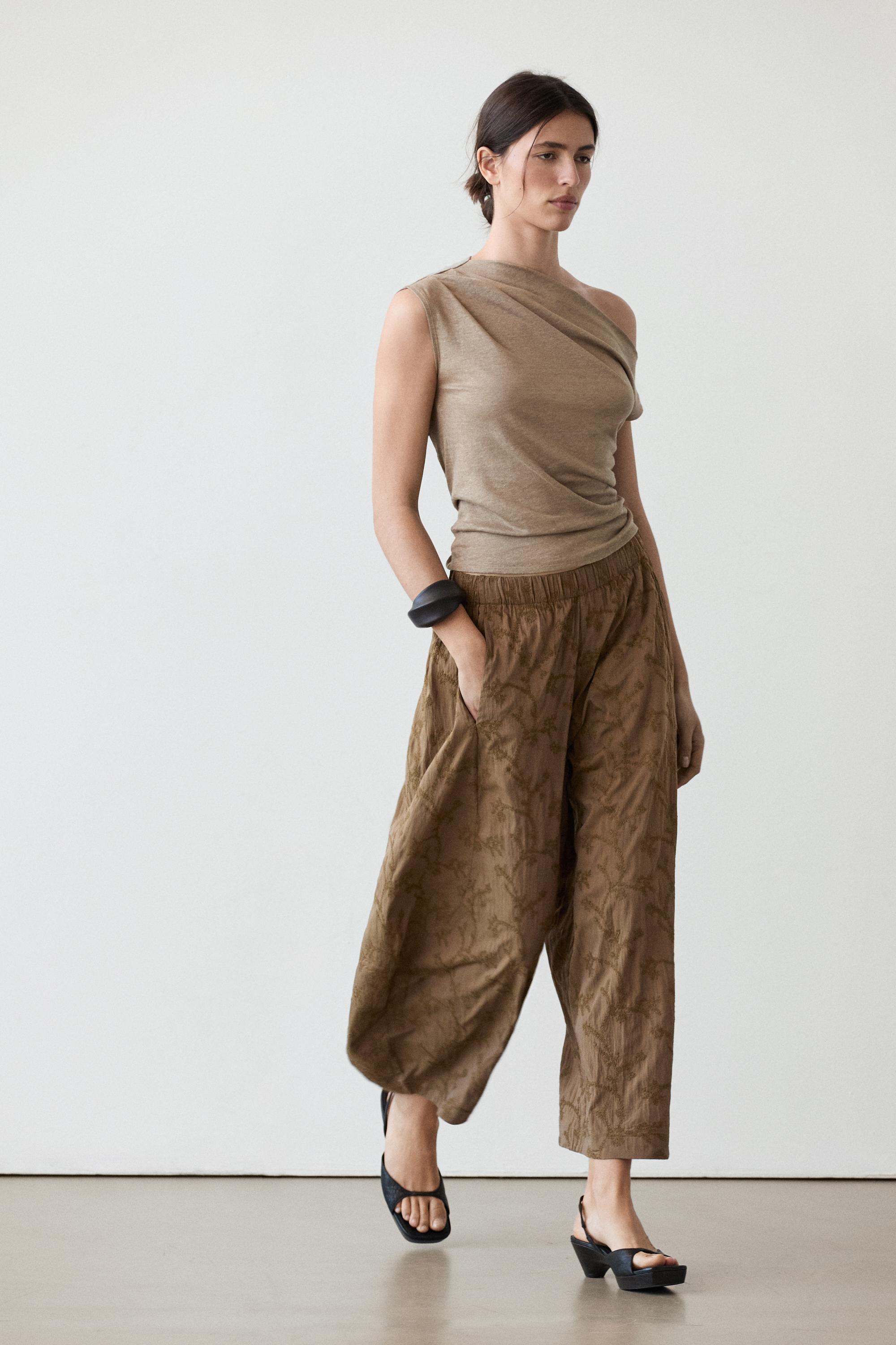 Trousers with embroidered detail and elastic waistband
