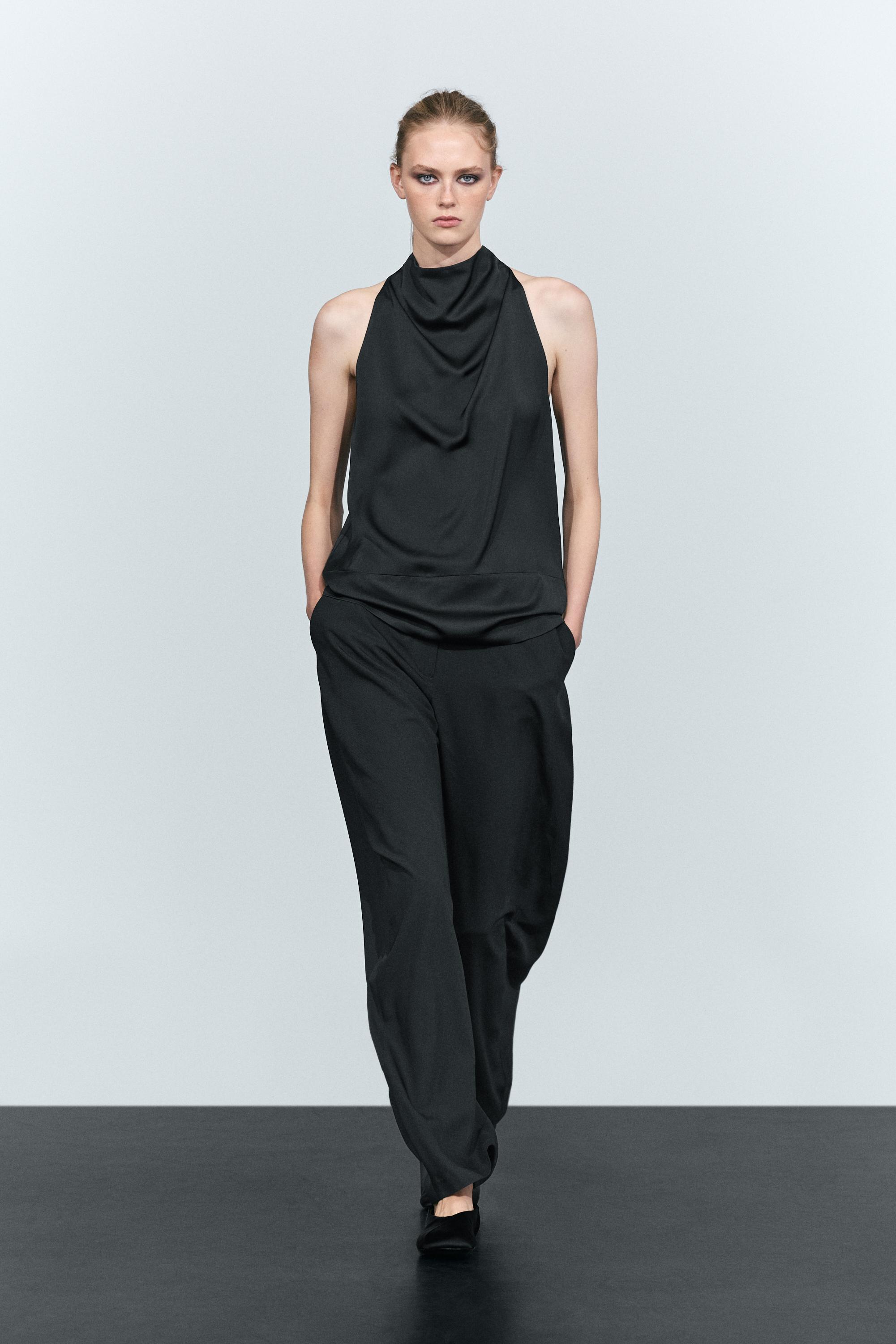 Flowing halter neck top with waistband effect