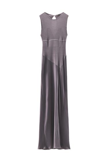 Front view of a sleeveless gray maxi dress with panel design and round neckline