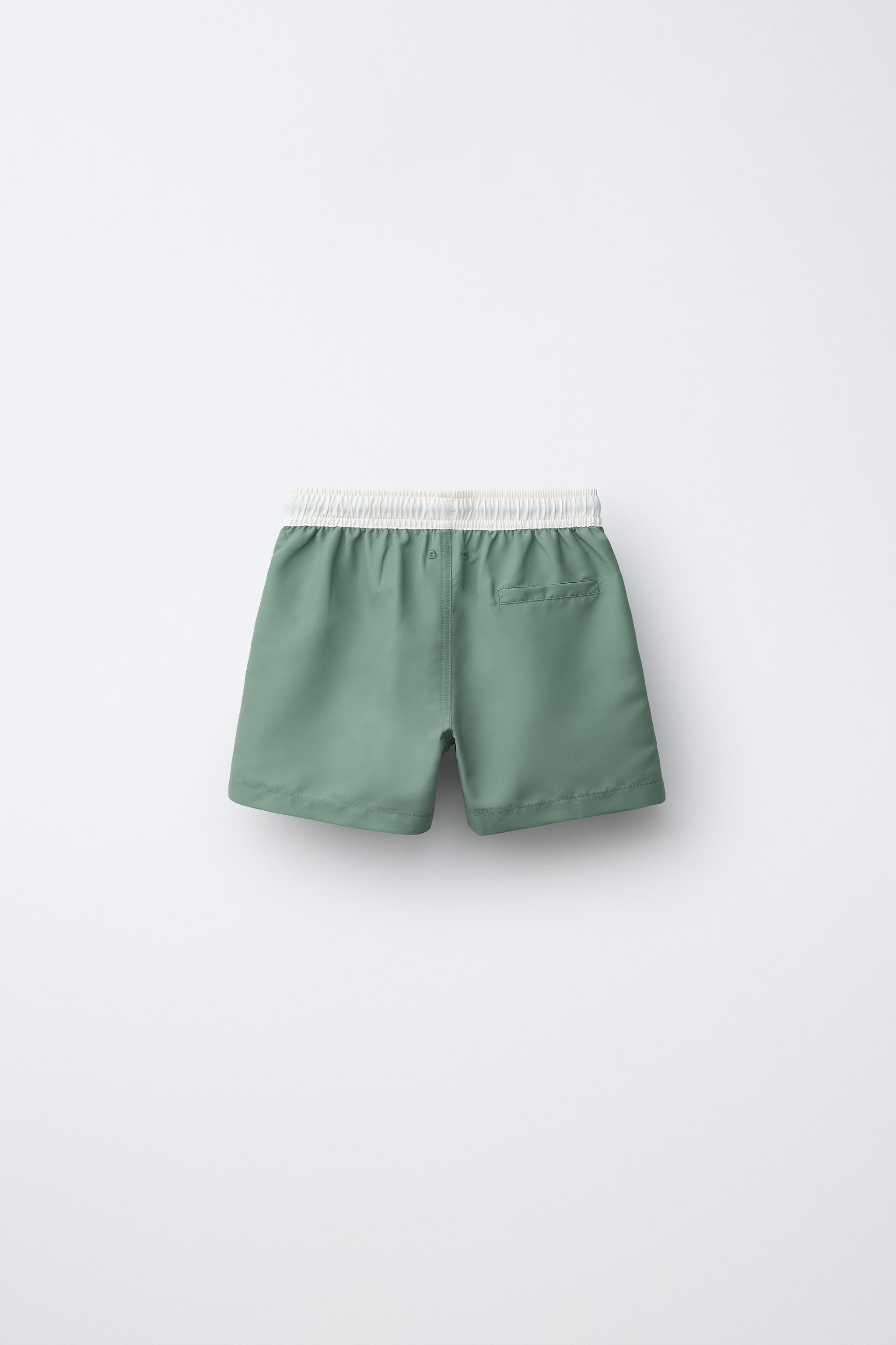 AGES 6-14 / MINECRAFT © MOJANG AB. ™ SWIM SHORTS