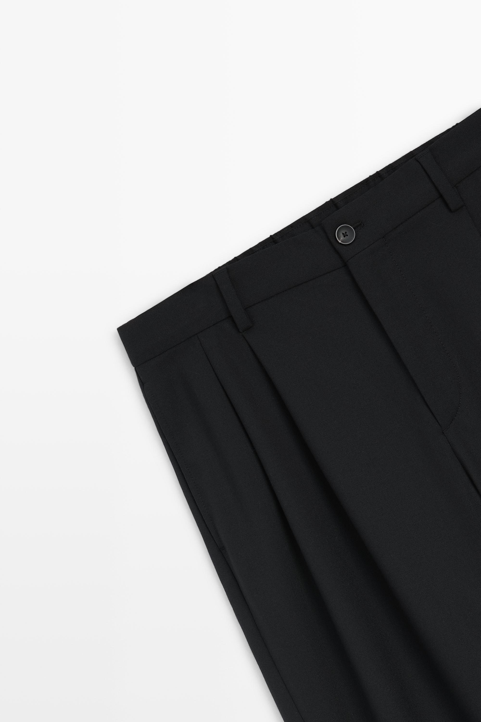 Pantalon relaxed fit à double pinces en daim
