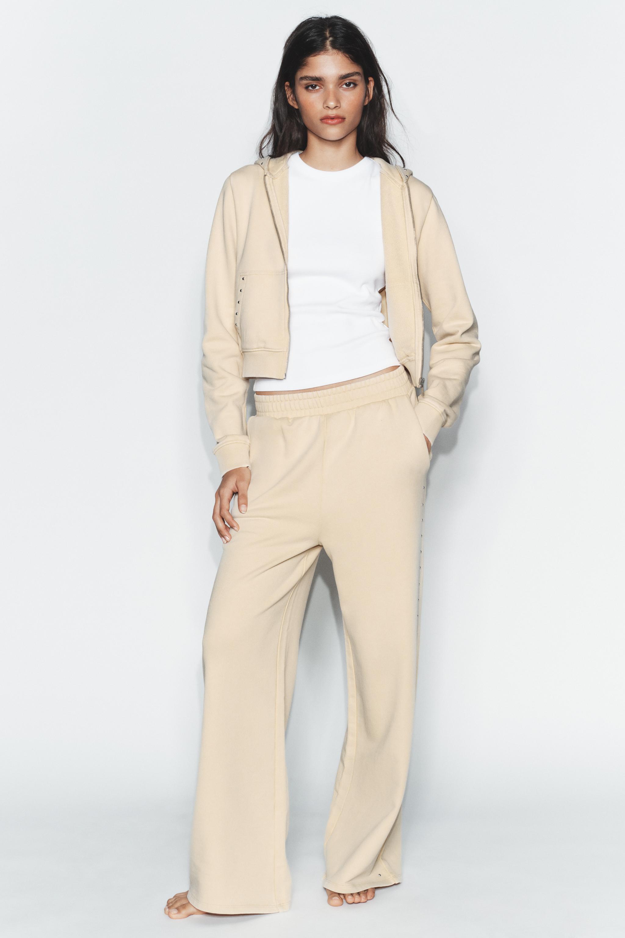 PANTALON EN MOLLETON EFFET DÉLAVÉ CLOUS