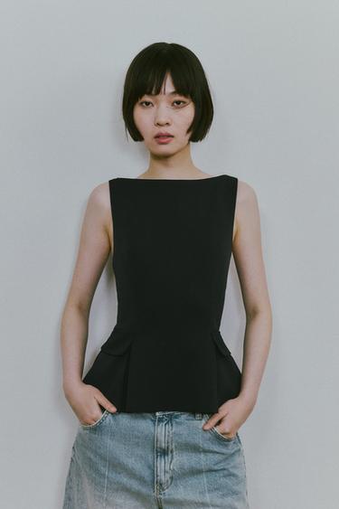 ペプラムトップスダークネイビーブルーZaraのペプラムトップス - ダークネイビーブルー 