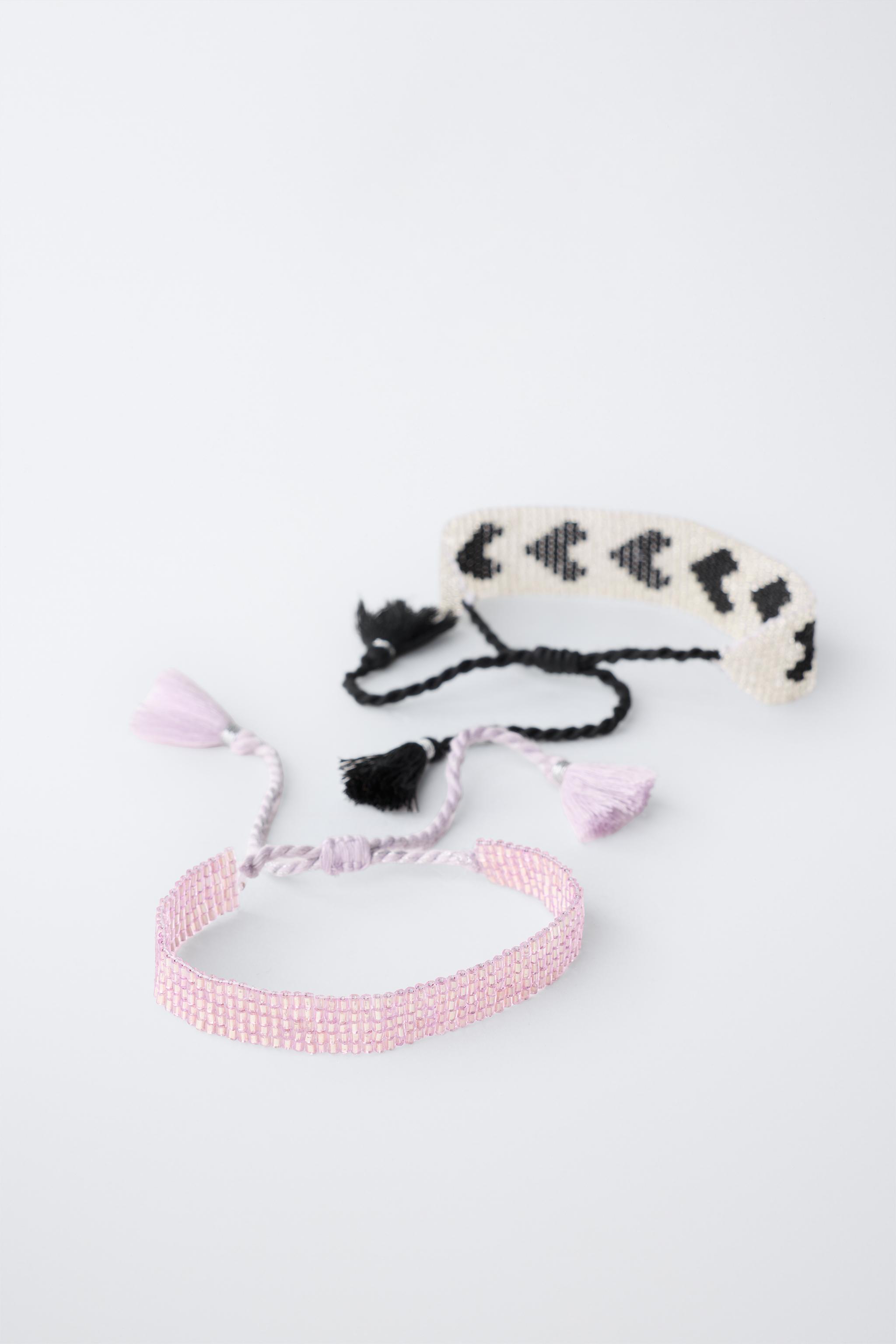 LOT DE DEUX BRACELETS AVEC FANTAISIE ÉTOILE