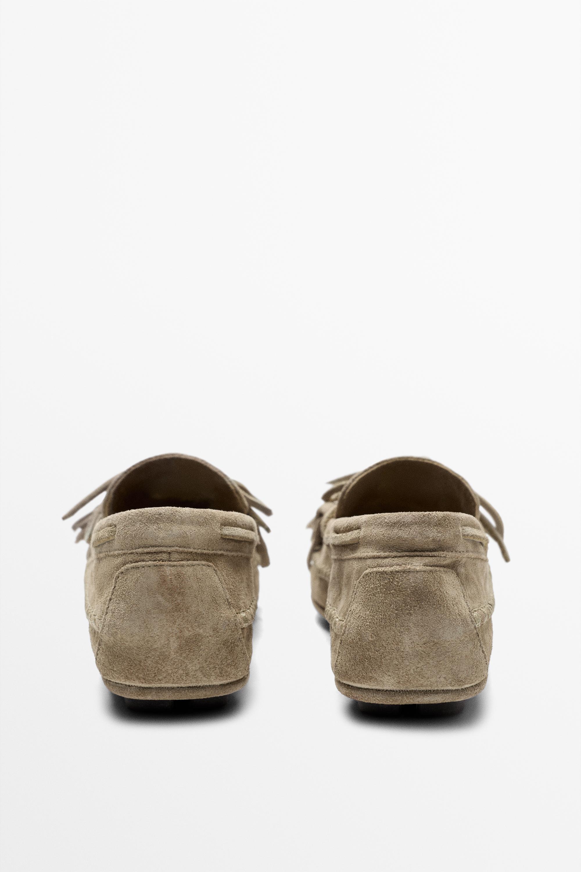 Leather loafers with fringing and tassels