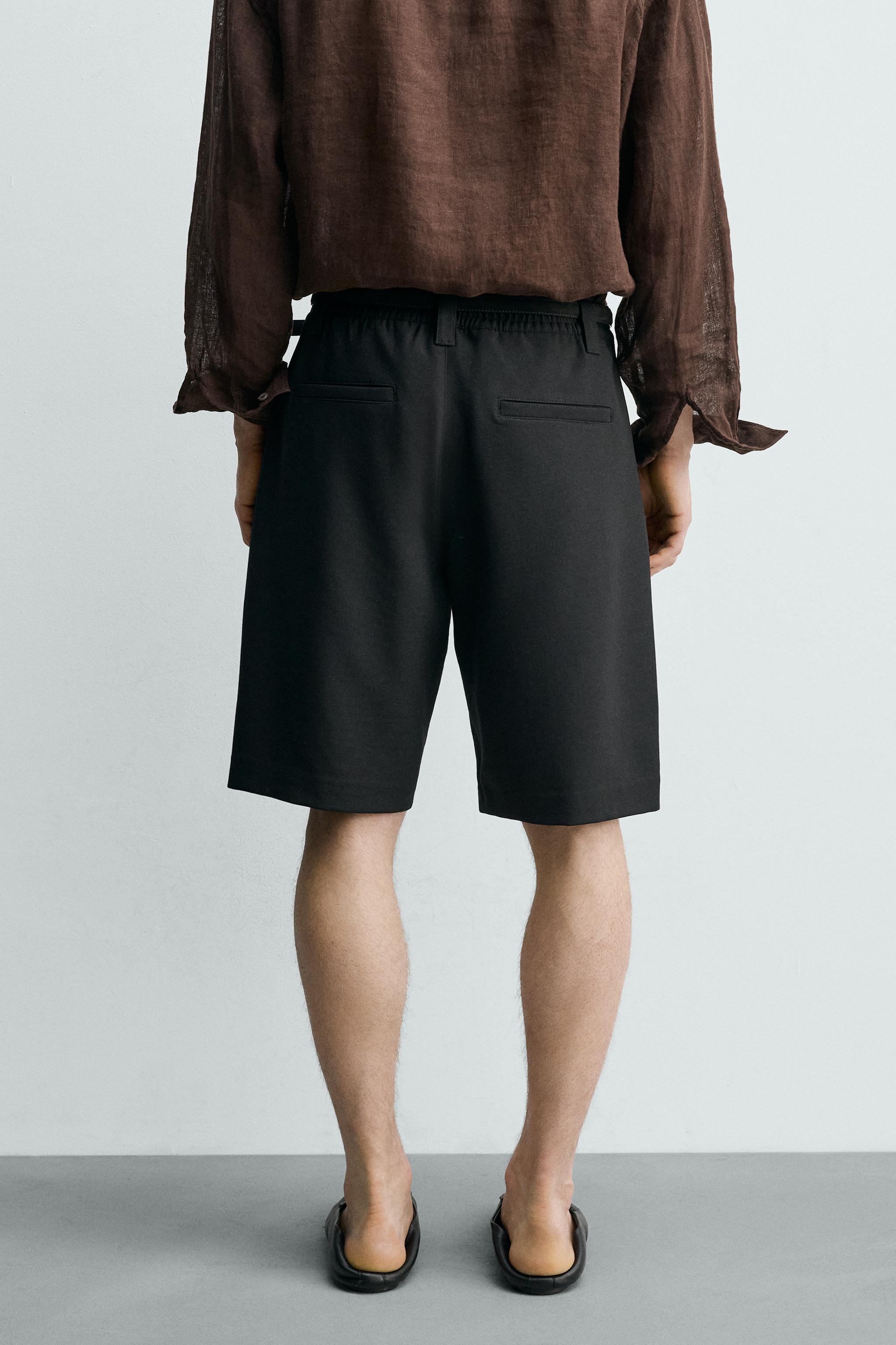 RELAXED FIT SIDE PLEAT SHORTS