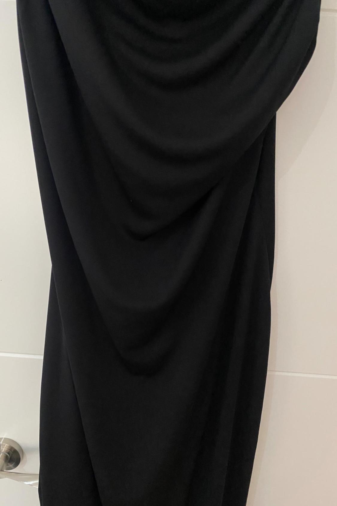Detail of black fabric with pleats.