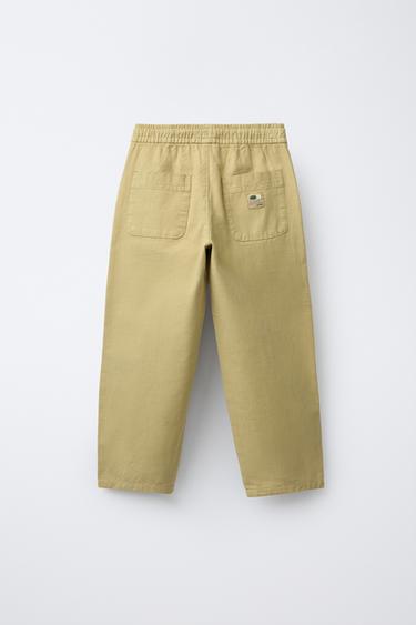 PANTALON EN COTON AVEC ÉLASTIQUES - Ocre de Zara - Image 1