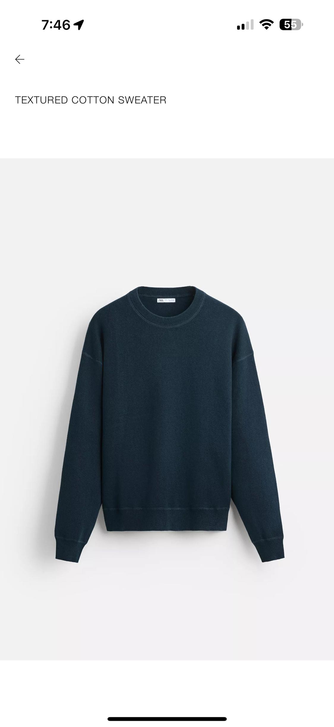 Dark blue textured cotton sweater hanging against a white background. Text on the image: "TEXTURED COTTON SWEATER".