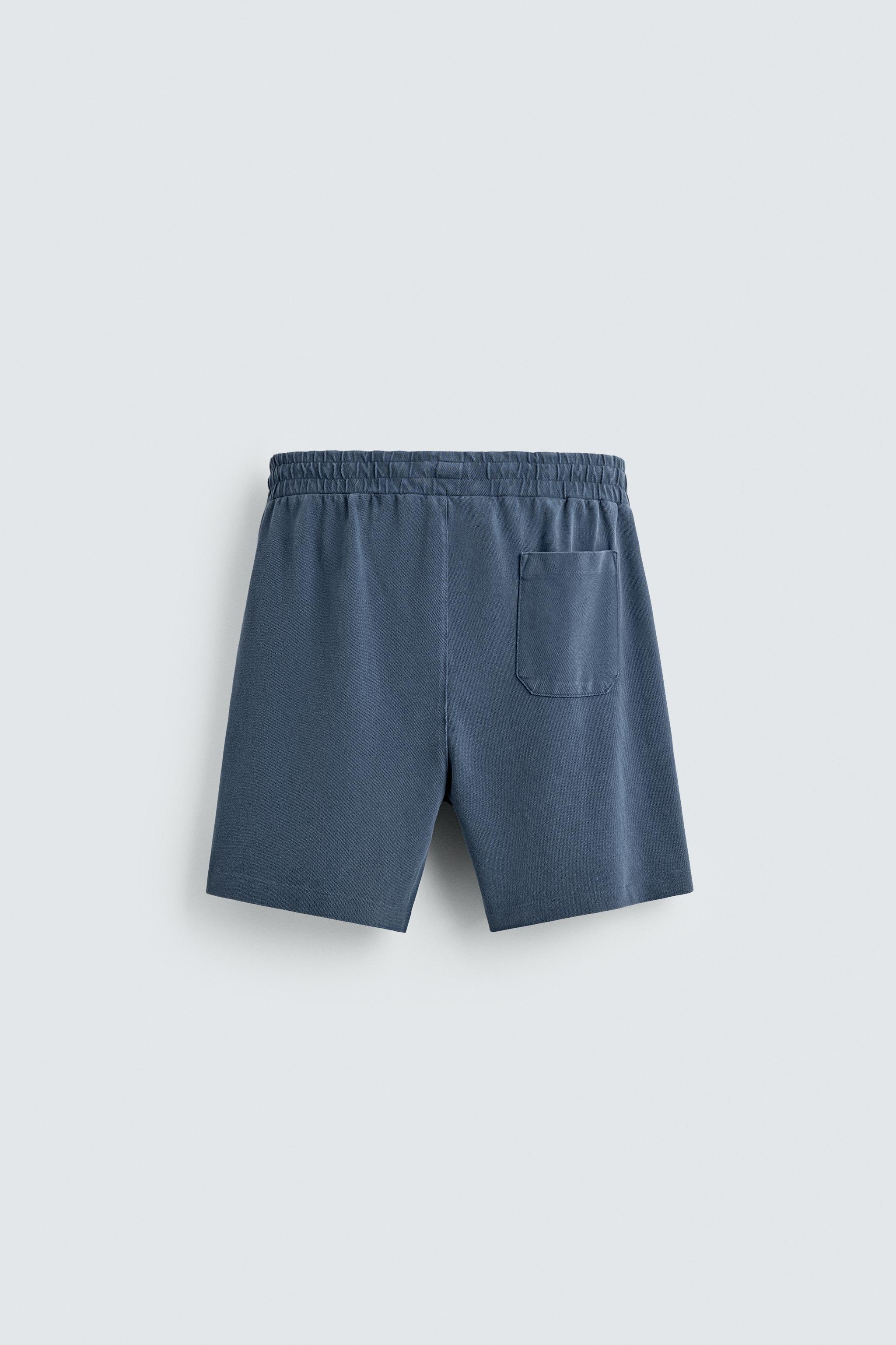 BERMUDA EN PIQUÉ REGULAR FIT DÉLAVÉ