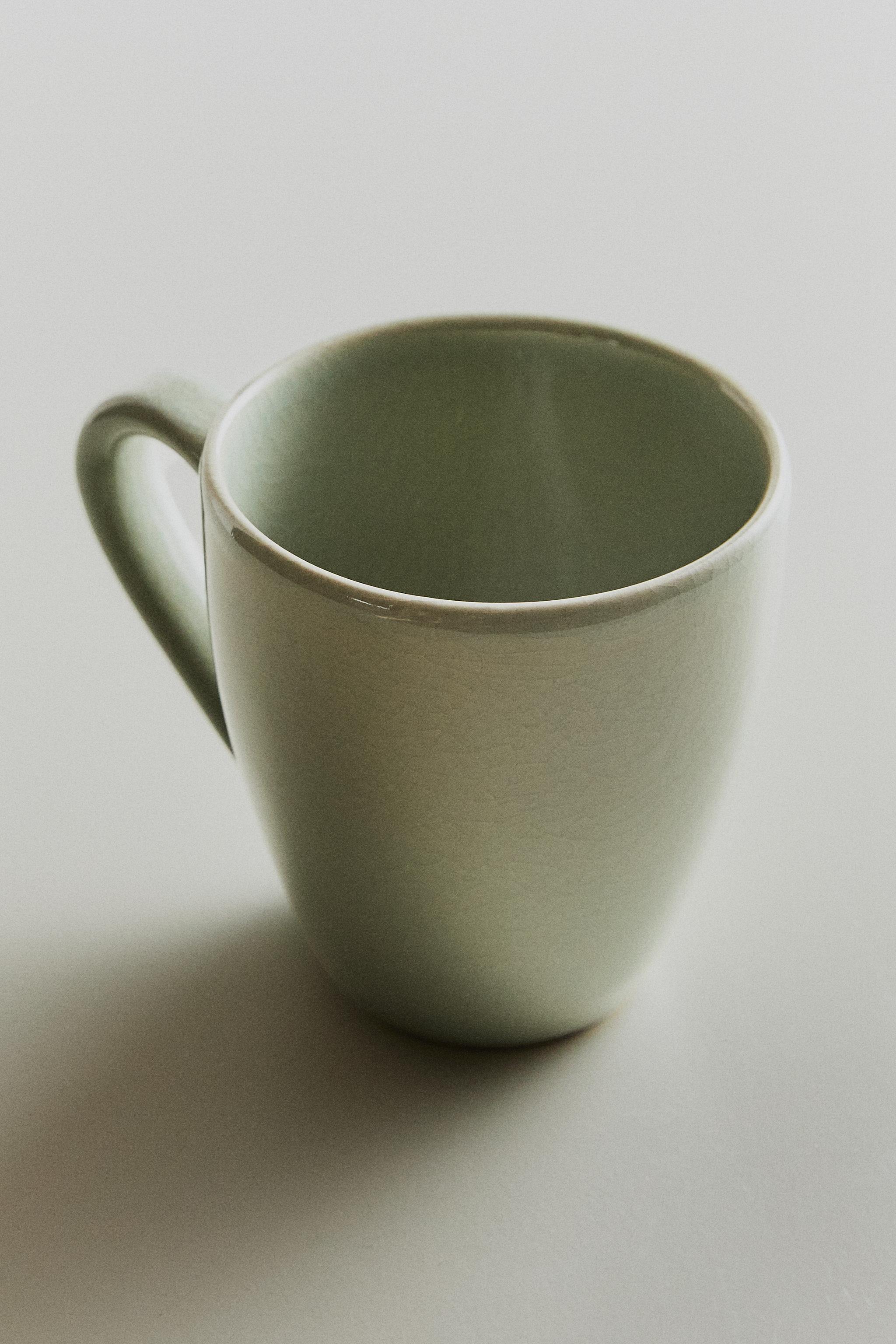 ENAMELED STONEWARE MUG