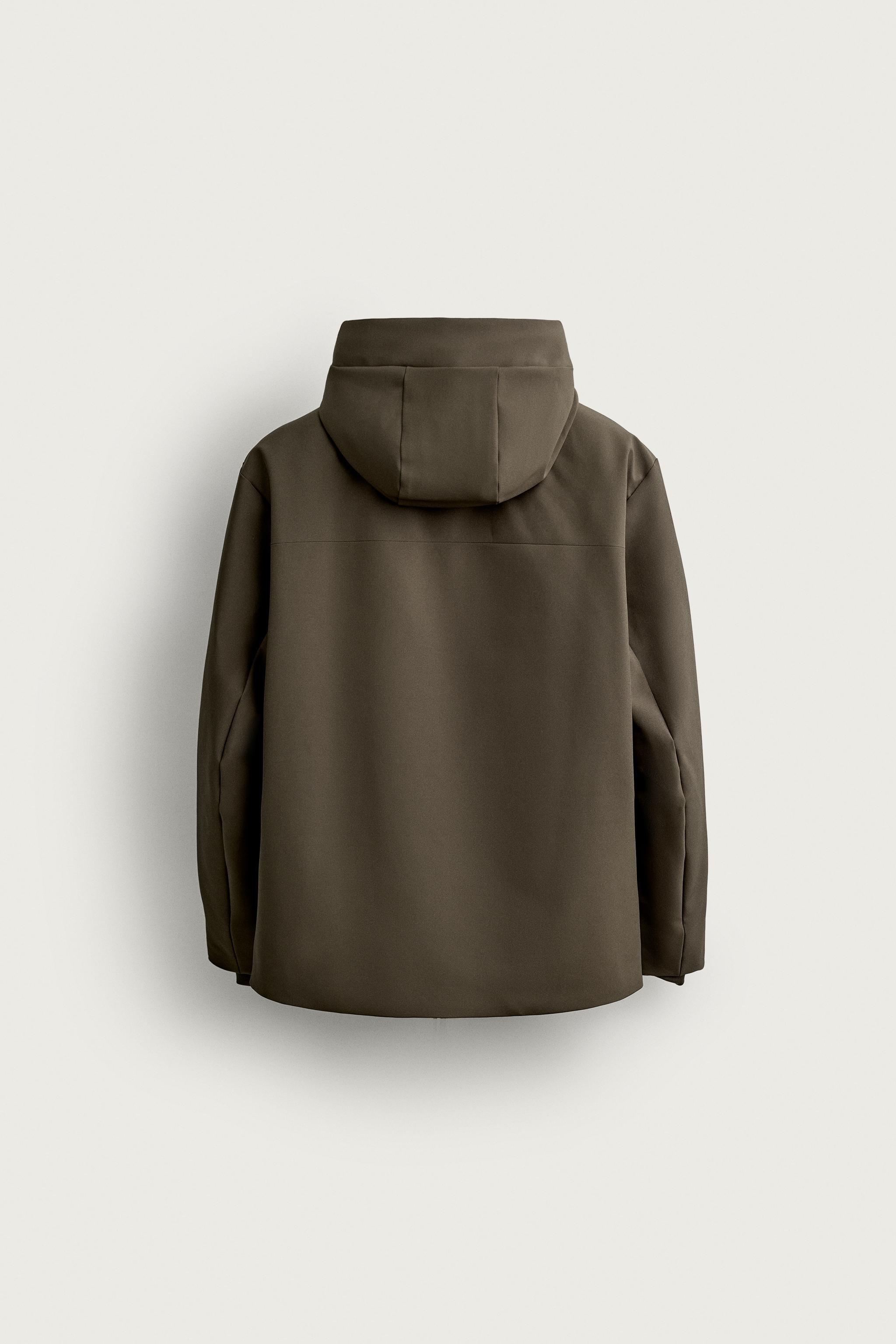 BLOUSON TECHNIQUE À CAPUCHE DÉPERLANT