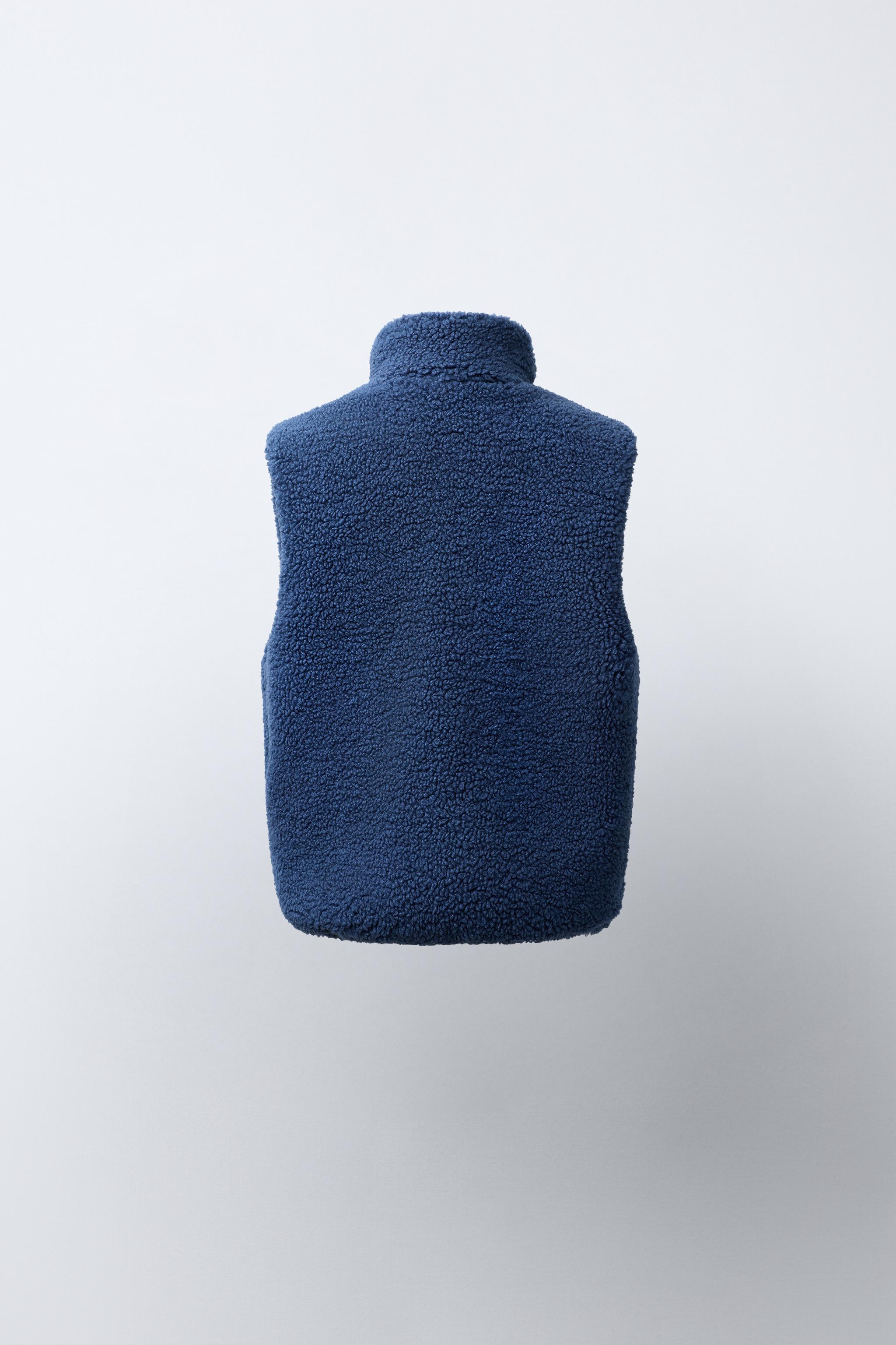 GILET EFFET MOUTON RETOURNÉ CONTRASTANT