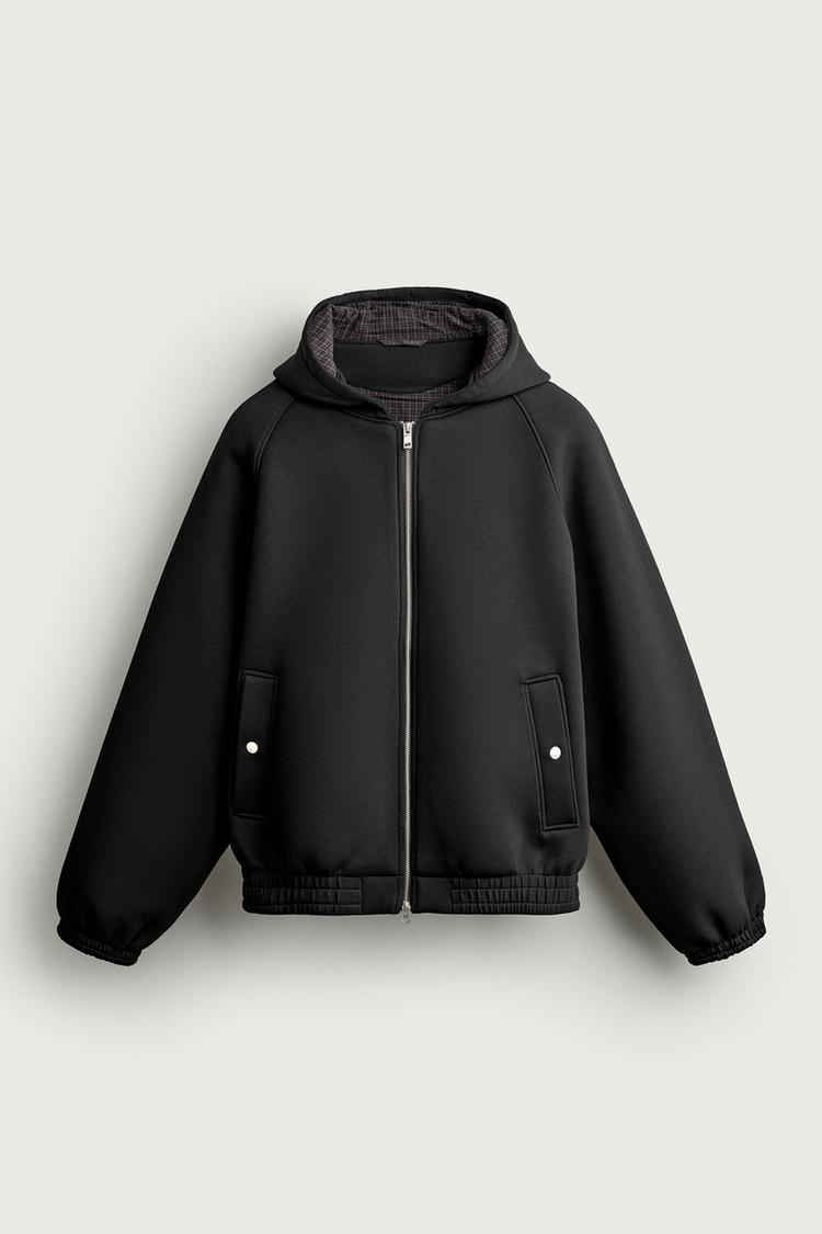 Chaqueta tecnica relaxed fit capucha