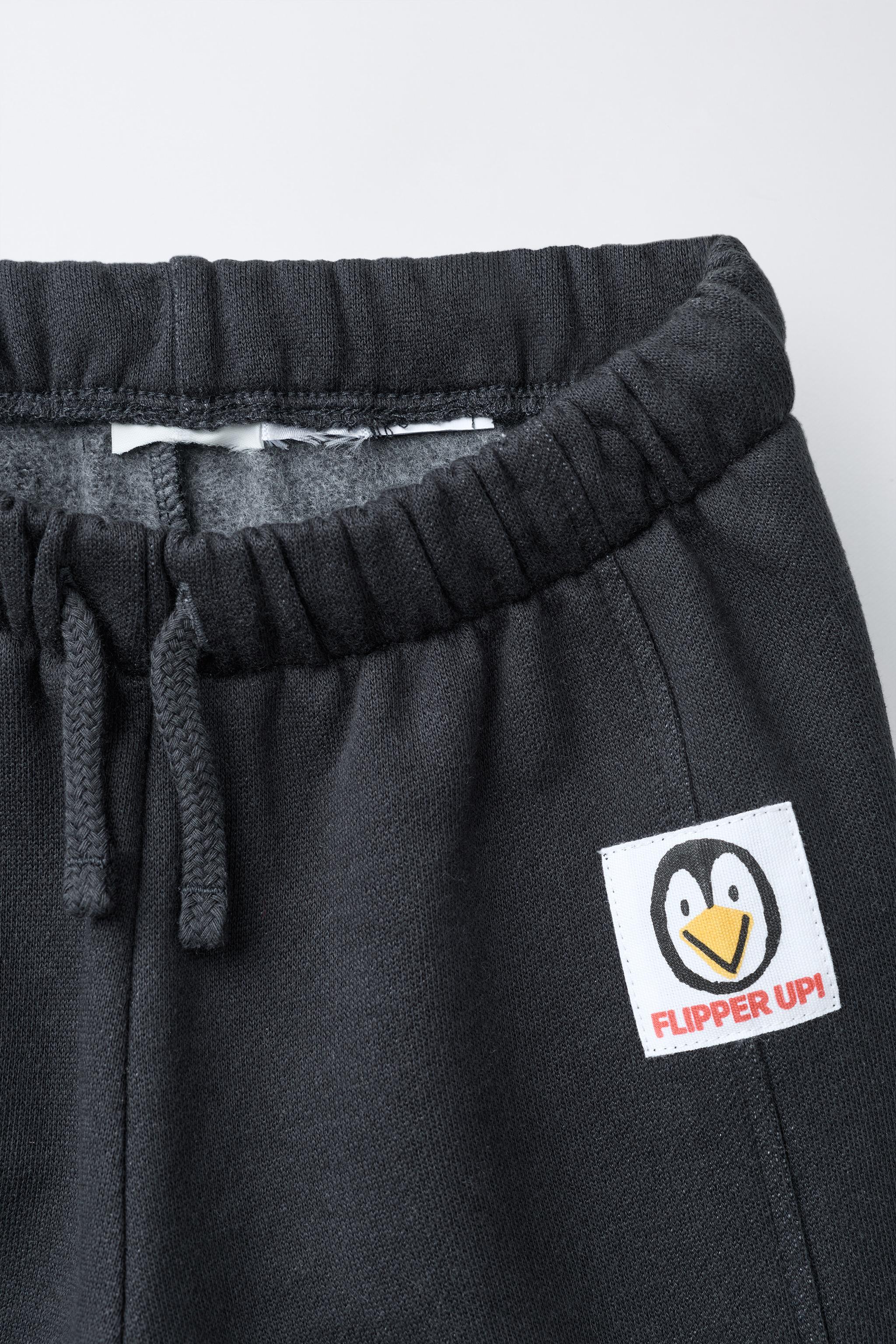 FLOCKED TEXT JOGGER PANTS