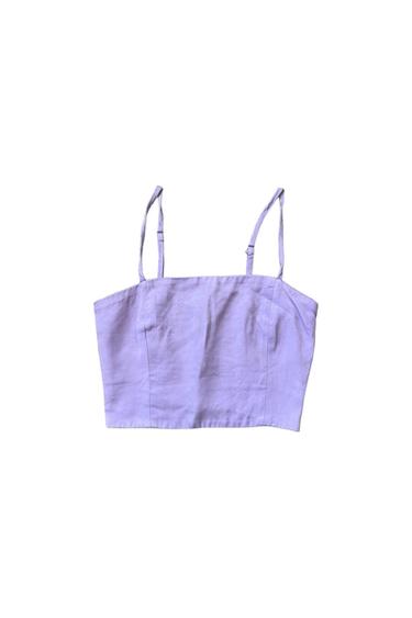 Lilac crop top with thin straps and a square neckline against a white background.